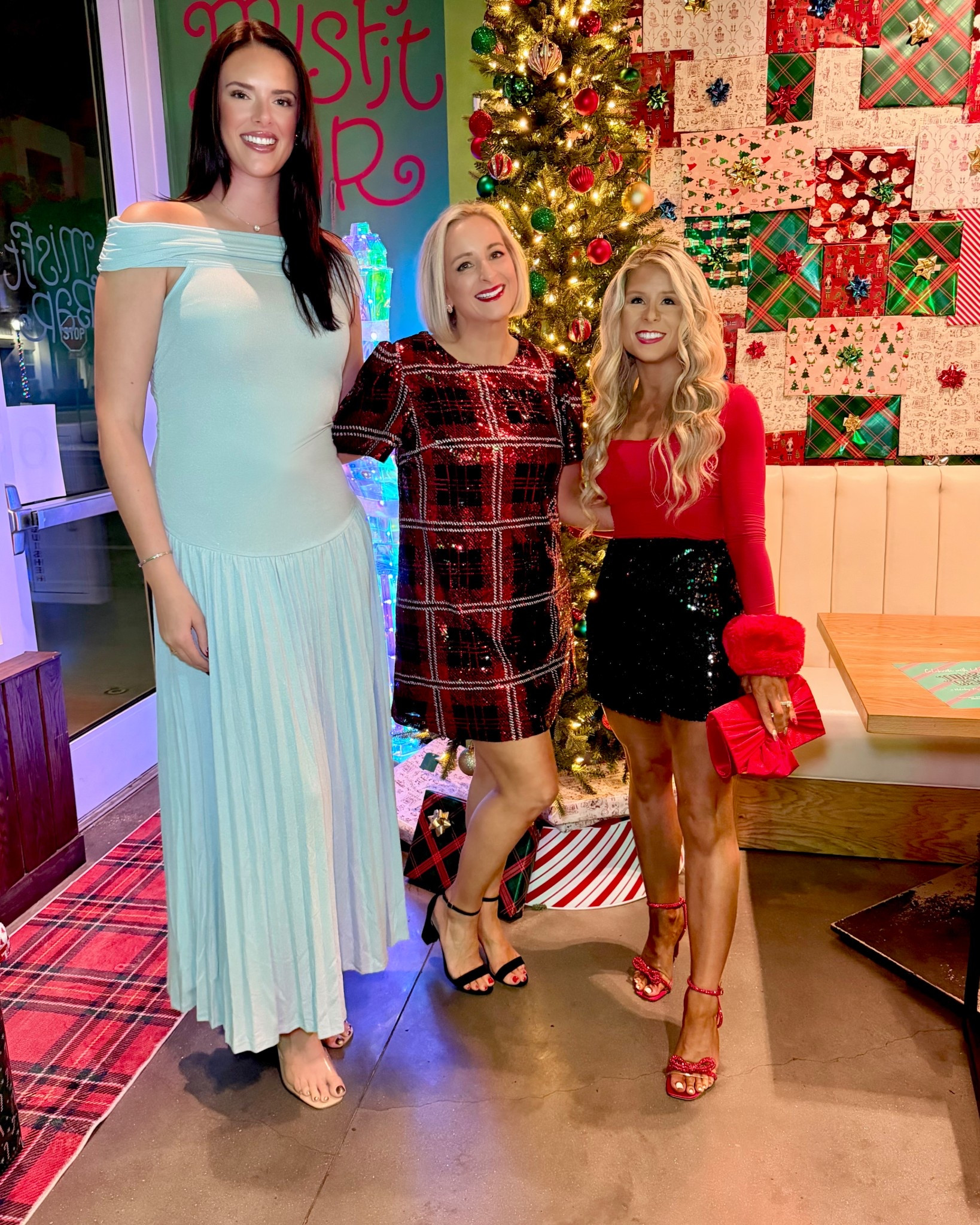 Holiday party outfit styled with a red long sleeve top, faux fur cuffs, black sequin miniskirt, sparkly red bow heels, and a matching red satin bow clutch! I added these faux fur cuffs to the red top for a fun, festive holiday outfit! They can be added to any holiday top and come in a variety of colors! 

Christmas outfit, Christmas party outfit, sequin skirt, sparkly skirt, holiday skirt, red heels, holiday heels, sparkly heels

#LTKHoliday #LTKSaleAlert #LTKootd