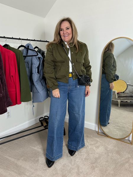 Olive green lined bomber jacket. It’s cropped. Comes to your waist. Great with jeans or over dresses. Wearing an XL. 

RUFFLE trim blouse is the perfect white blouse alone or under jackets and sweaters. Wearing size 2.0



#LTKmidsize #LTKover40 #LTKfindsunder100