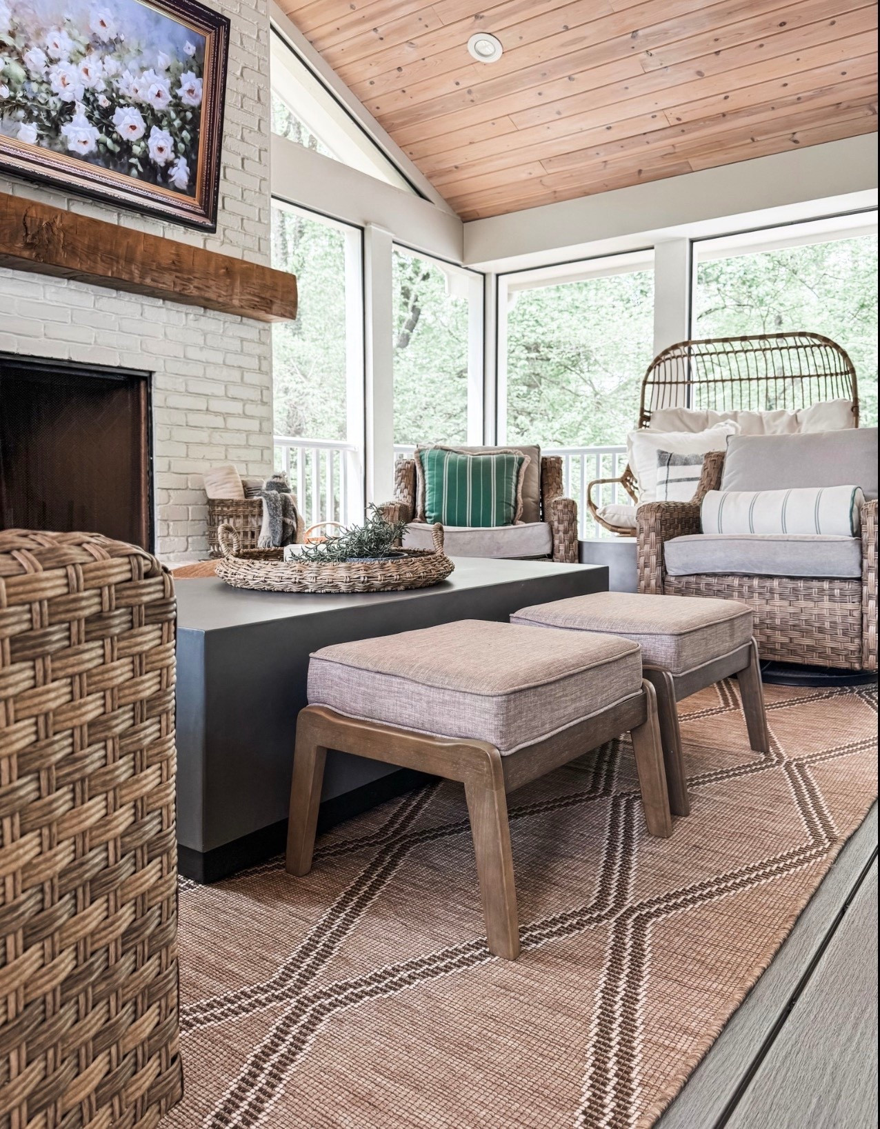 This sunroom seating area is all about relaxed, layered comfort 🌿 Featuring wicker lounge chairs, a rattan accent chair, neutral outdoor cushions, striped throw pillows, and a woven area rug, this space blends cozy indoor style with outdoor living. The wood plank ceiling, painted brick fireplace, rustic wood mantel, and woven coffee table styling make it the perfect spot for slow mornings and easy entertaining.

#eanesinteriors #sunroomdecor #outdoorliving #wickerfurniture #rattanchair #cozyseating #neutraldecor #layeredtextures #outdoorrug #ottoman #coffeetabledecor #throwpillows #woodceiling #fireplaceinspo #cozyhome #interiordesign #homeinspo

#LTKHome #LTKSeasonal #LTKdayinmylife