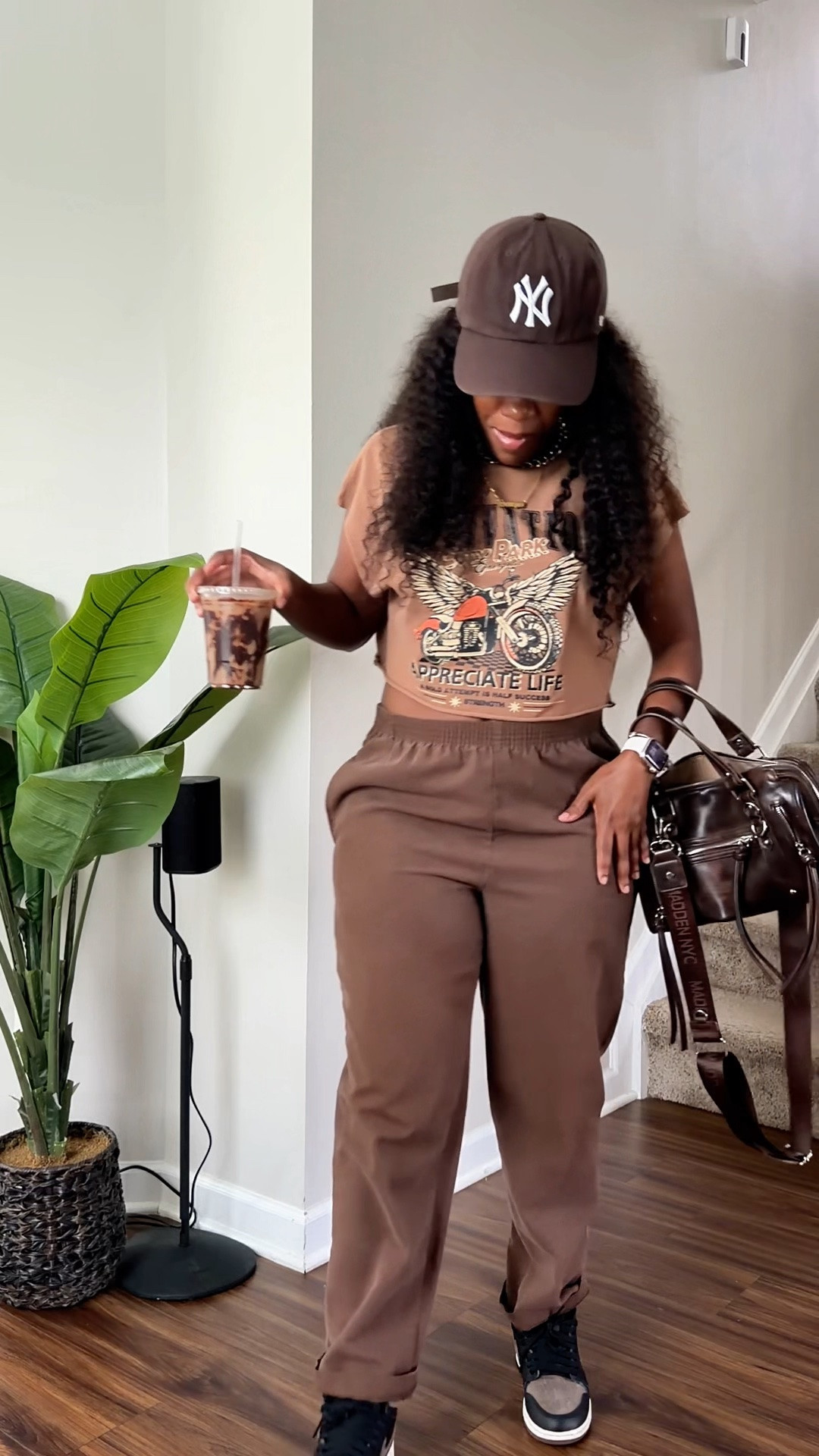 Looking for an easy brown outfit idea? I paired brown pants with a brown graphic tee, sneakers and a baseball cap for a casual tonal look that’s comfortable but still feels put together. This is an easy everyday outfit for running errands, grabbing coffee or having a casual day out.

#LTKOver40 #LTKPetite #LTKootd