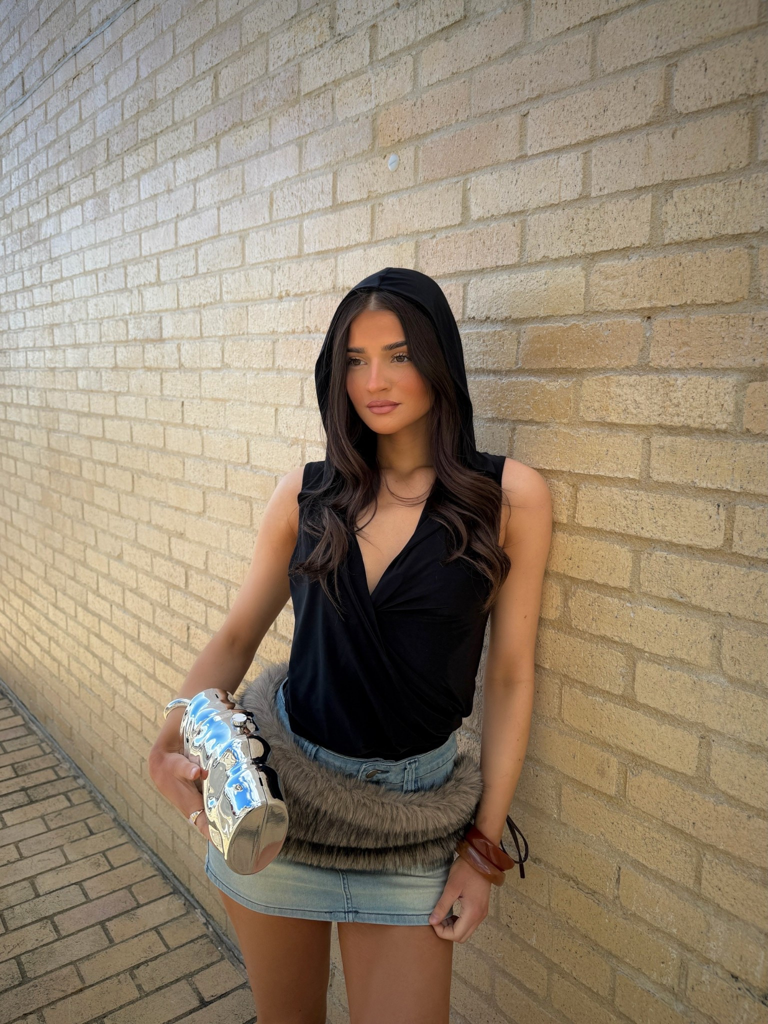 outfit inspo, outfit inspiration, festival outfits, coachella outfits, cool girl outfits, denim mini skirt, faux fur skirt, fur belt, hooded top, black hood top, silver clutch 

#LTKeurope #LTKspring