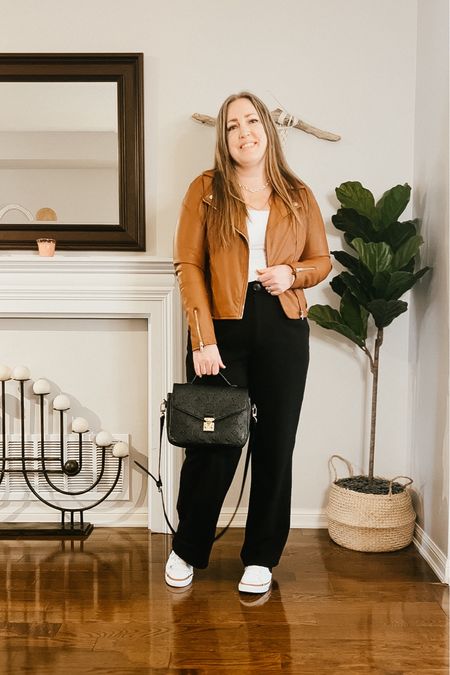 Spring outfit
Black wide leg trousers, white bodysuit, faux leather jacket, Nike shoes, silver jewelryy

#LTKstyletip #LTKover40 #LTKshoecrush