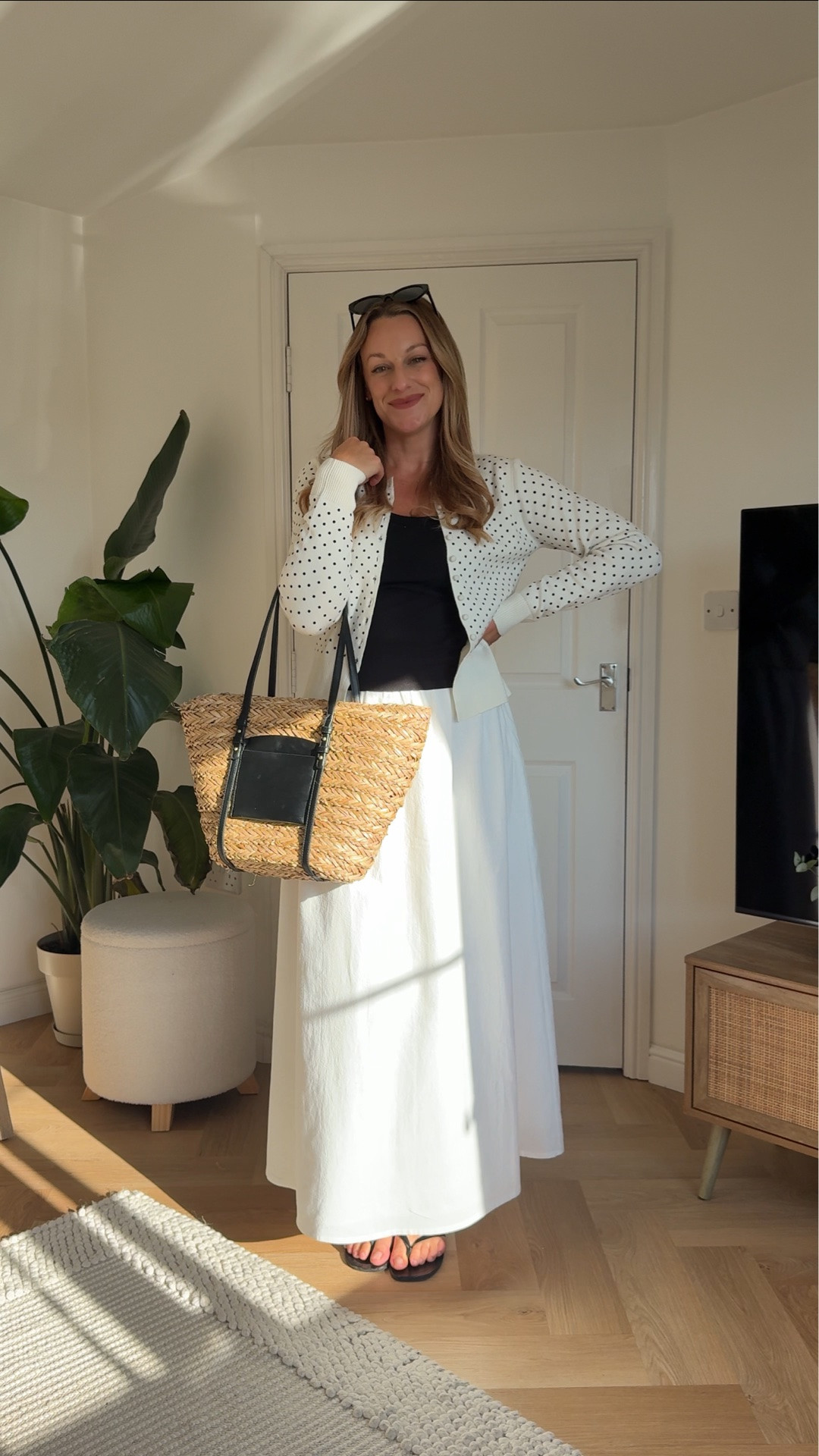 Spring outfit idea white maxi skirt, black tank top and white and black polkadot cardigan with leather black flip-flops and a straw & black leather  summer bag- ￼ mid-size spring look day 25 of 30

#LTKsummer #LTKuk #LTKspring