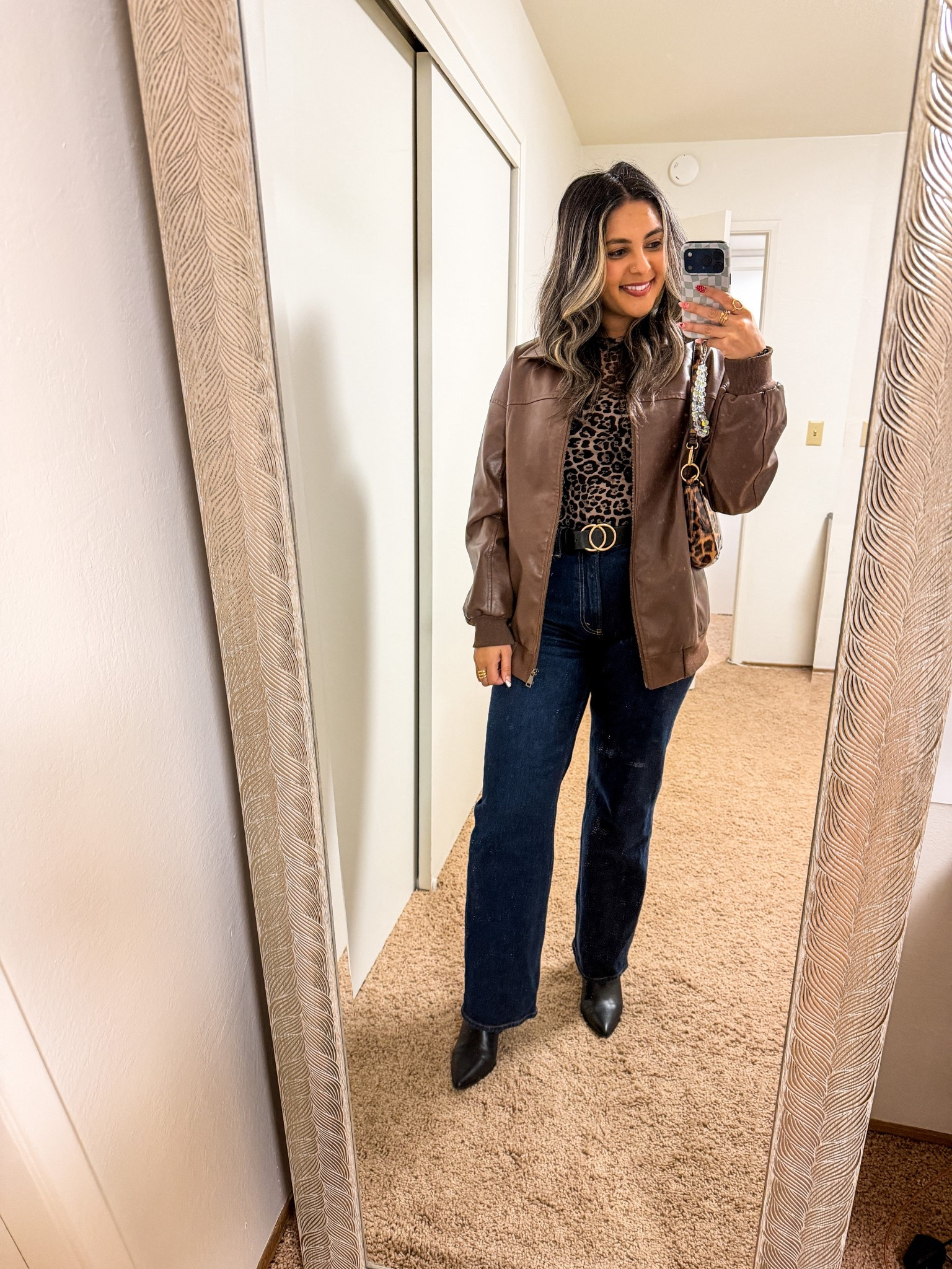 This brown faux leather jacket is the perfect layering piece for fall and pairs so well with a classic leopard top. Styled with high-waisted dark denim, a statement belt, and black pointed booties for an easy day-to-night look.



#LTKgrwm #LTKdayinmylife #LTKootd