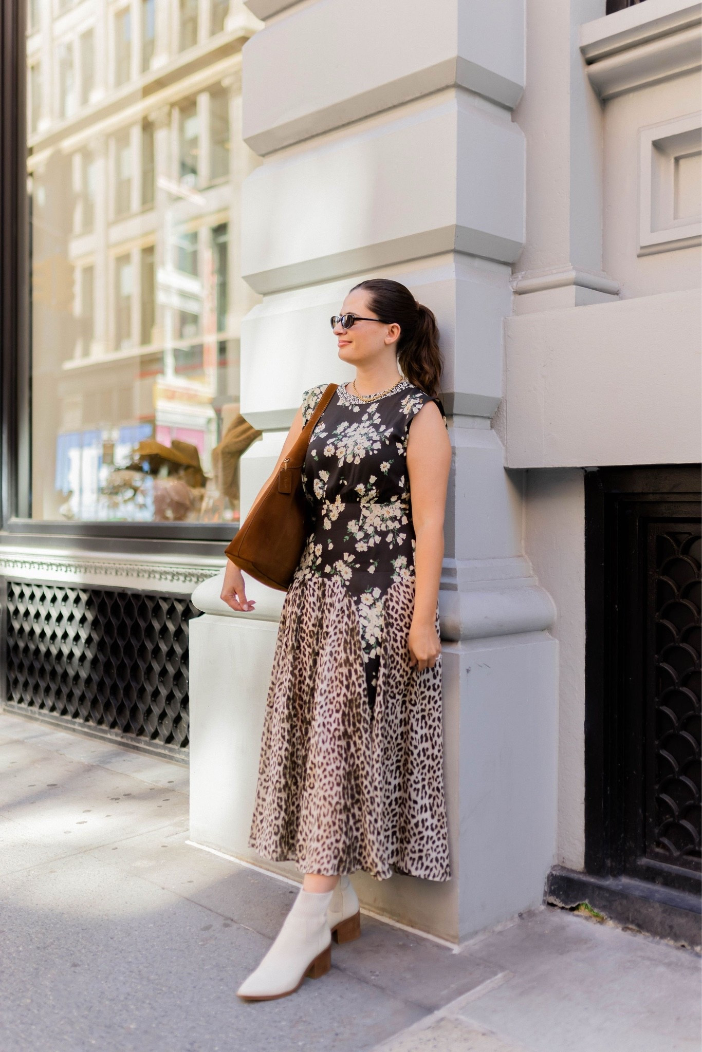 What I wore to fashion week! I love this patterned midi dress from Rixo that mixed leopard and floral prints. I went for my Coach Brooklyn bag and some white boots as we transition to fall weather.

#LTKootd