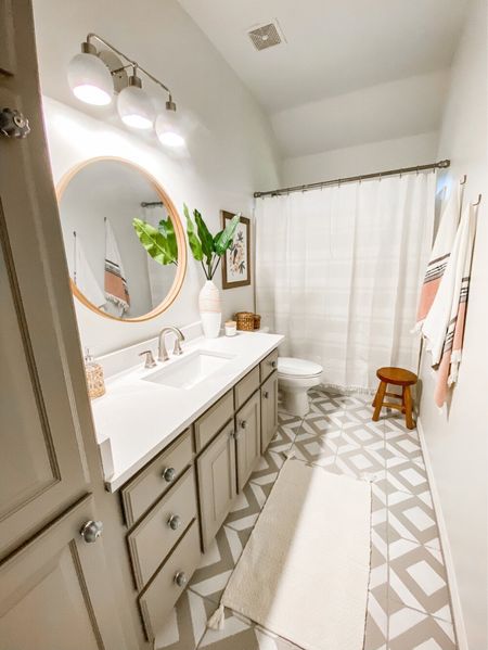 A clean and welcoming space from the guest bathroom. Farmhouse Living | Primary Bathroom |Bathroom Ideas | Interior Design | Round Wall Mirror | Tile Designs 

#bathroom #farmhouseliving #bathroomdecor #bathroomideas #bathroominspo #primarybathroom #interiordesign #homedesign


#LTKhome #LTKFind #LTKfamily