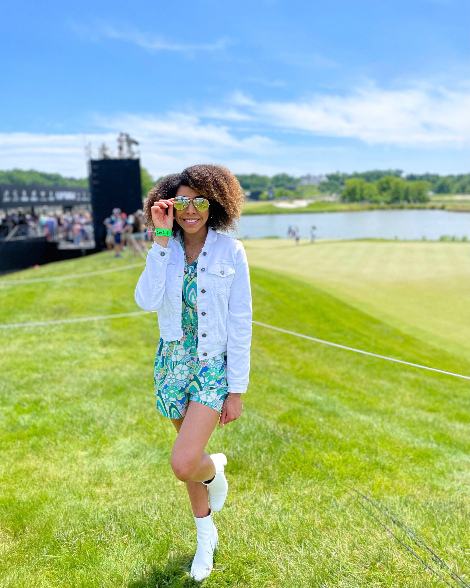 LIV Golf tournament! Decided to bring a pop of color 🤍 . Romper & sunglasses are on sale! 

Spring fashion. Summer fashion. Romper. White boots. White Jean jacket  

#LTKSeasonal #LTKunder100 #LTKsalealert