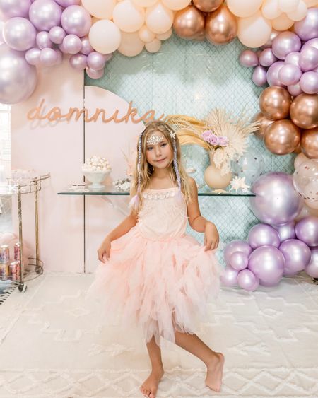 Beautiful baby pink tulle dress with beading and feather details. Amazing quality and perfect for a birthday party, family photos, holidays, or wedding! Runs very large in our experience so I sized down 2 sizes to a 4-5 for our average size 7 year old. Added starfish hair clips, ombré hair, and face jewels to complete this mermaid look!

#LTKwedding #LTKkids #LTKfamily