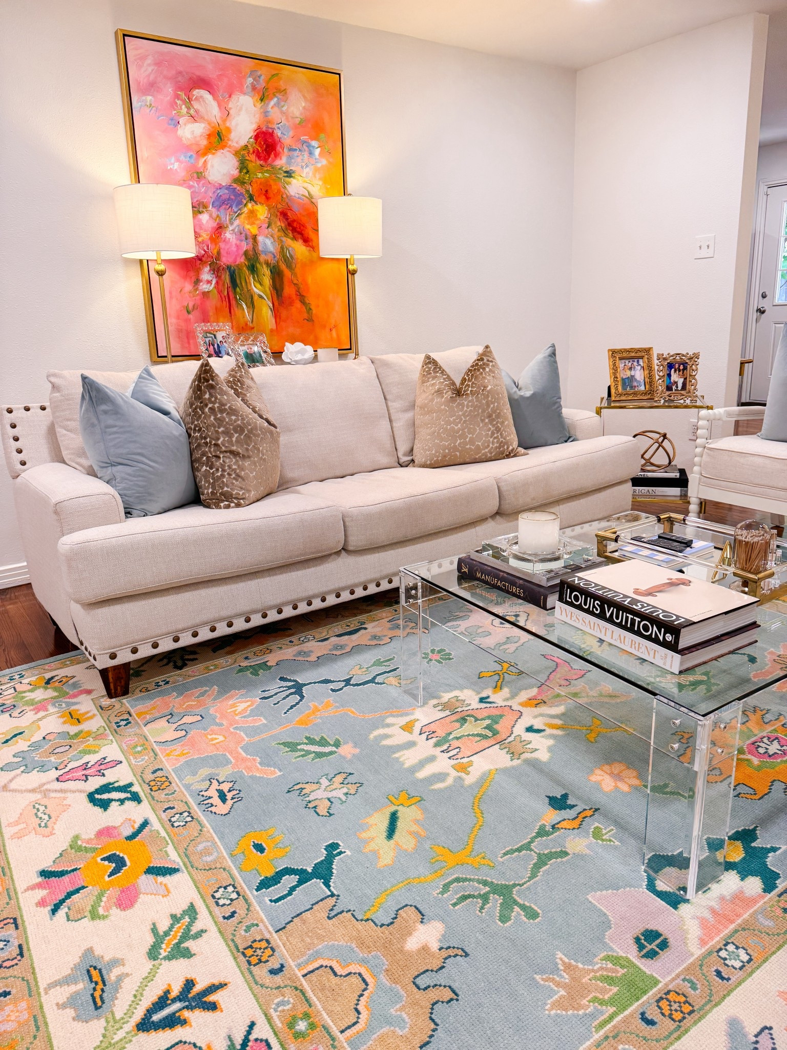 Living room. Colorful. Home. Decor. Lamps. Acrylic table. Coffee table books. Gold. Grand millennial.  Oushak rug  

#LTKHome #LTKFamily