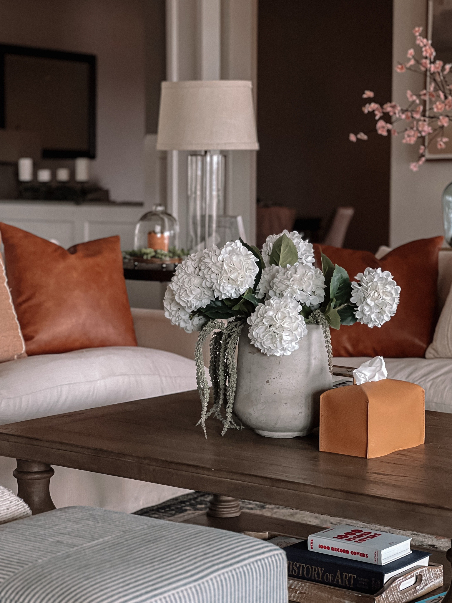 There’s just something about this space that makes me want to curl up with a good book (or let’s be real—scroll Pinterest for our next DIY project). The mix of textures—soft knits, warm leather, and that perfectly weathered wood—makes it feel inviting without trying too hard. And don’t get me started on those hydrangeas… they might be faux, but they’re sticking around because I love them that much.

If you’re looking to bring this vibe into your home, I’ve linked my favorite finds on LTK! 🛍️ #LTKhome #CozyVibes #HomeWithHeart

#LTKHome