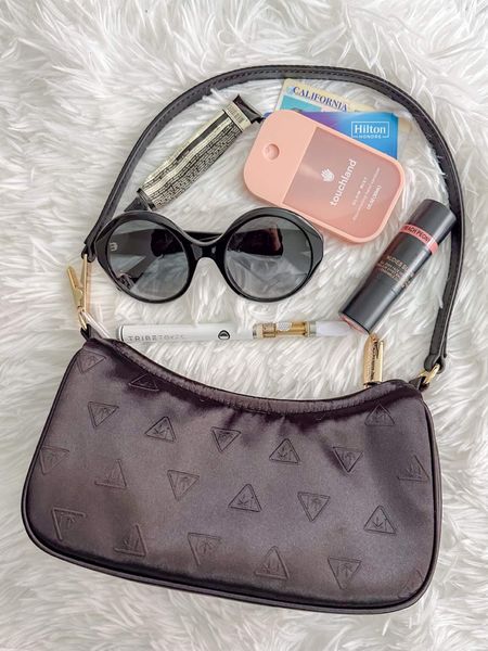 FRIDAY ESSENTIALS ⭐️
1) Edie Parker Smokin' shoulder bag 
2) Gucci sunglasses 
3) TribeTokes D8 THC starter kit
4) Touchland hand sanitizer 
5) Aesop travel hand lotion (part of the Departure Kit)
6) Nudestix "Nudies Bloom" which doubles as a blush and lipstick 
7) ID and credit card
*forgot to add my keys and mace! 

#whatsinmypurse #edieparker #tribetokes #fridaynightessentials 

#LTKitbag #LTKCyberWeek #LTKHolidaySale
