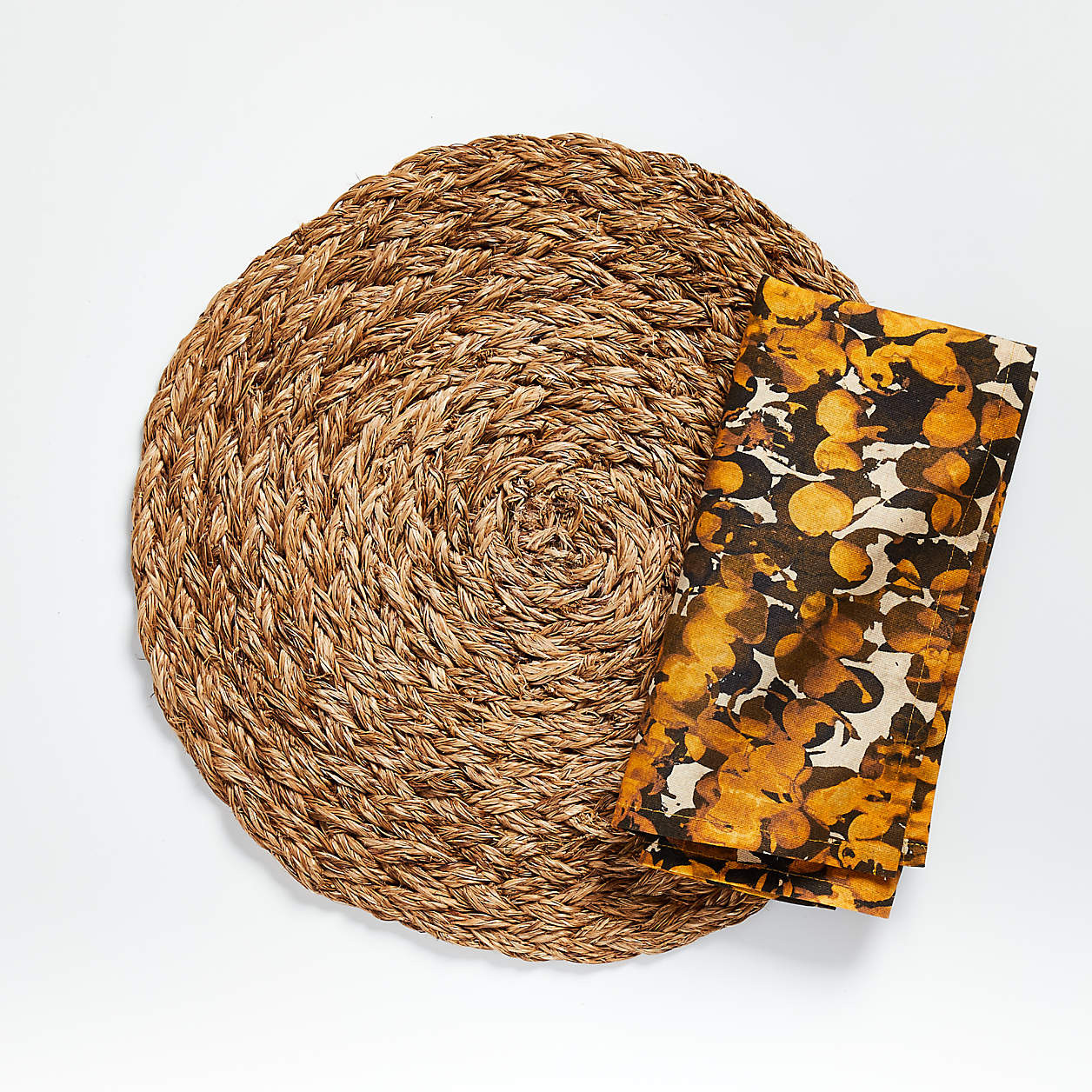 Bali Dark Abaca Woven Round Placemat + Reviews | Crate & Barrel | Crate & Barrel
