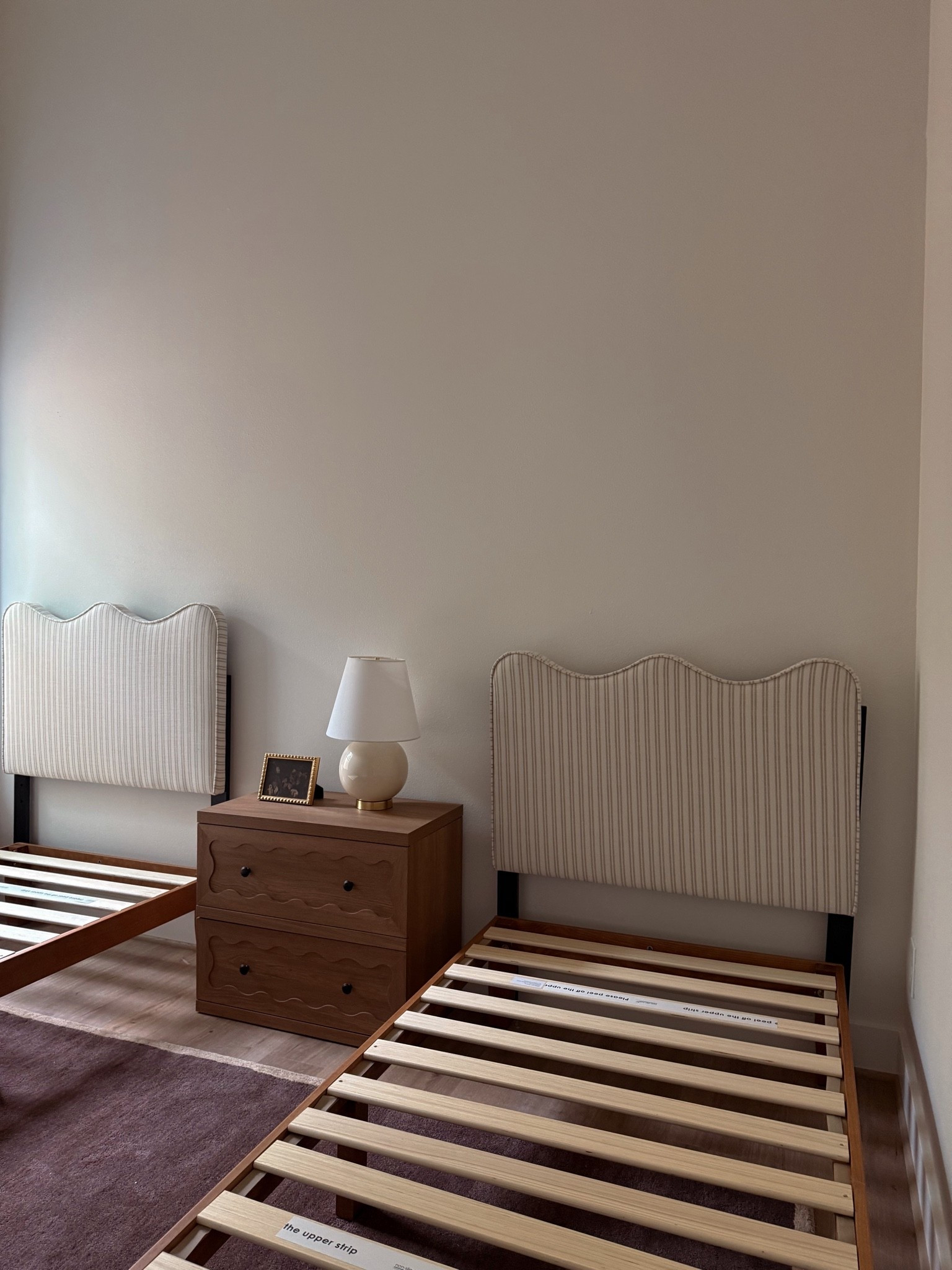 guest bedroom -  Nightstand, twin bed frame and upholstered headboard, brown rug

#LTKHome