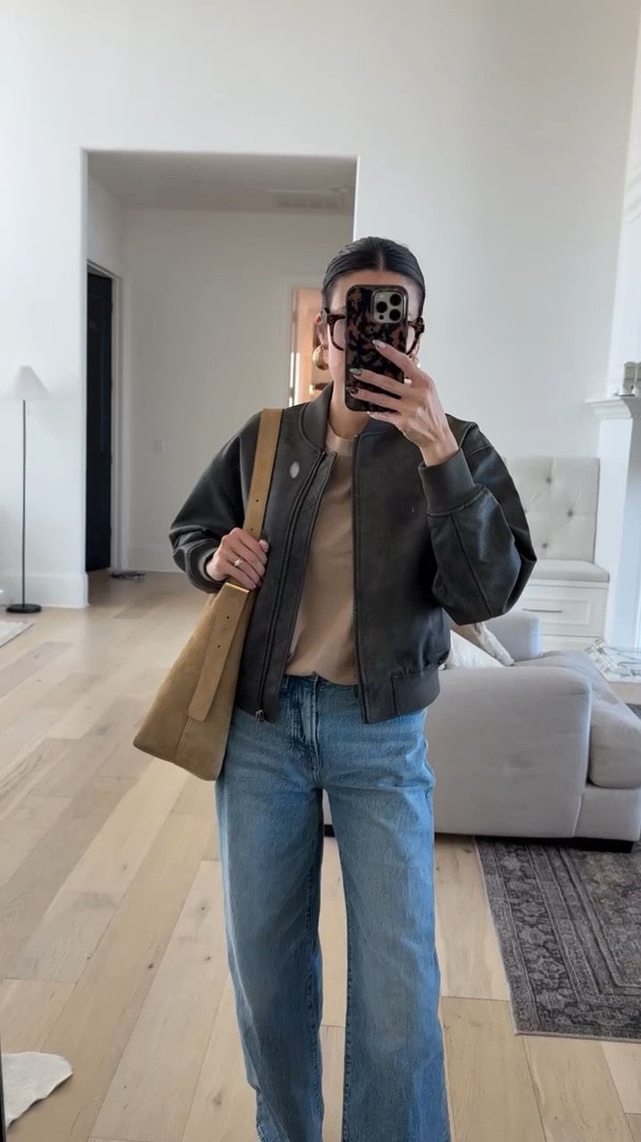 Fall outfit details 🤎 my tee is under $10 and this jacket is a fall staple!  My jeans are on sale 20% off this weekend and I’ve been wearing my suede bag on repeat

Fall outfits, fall style, casual style, Madewell jeans, bomber jacket, brown jacket, fall jacket, basic tee, bucket bag, Madewell sale, Walmart finds, Walmart fashion, Christine Andrew 

#LTKVideo #LTKFindsUnder50 #LTKStyleTip
