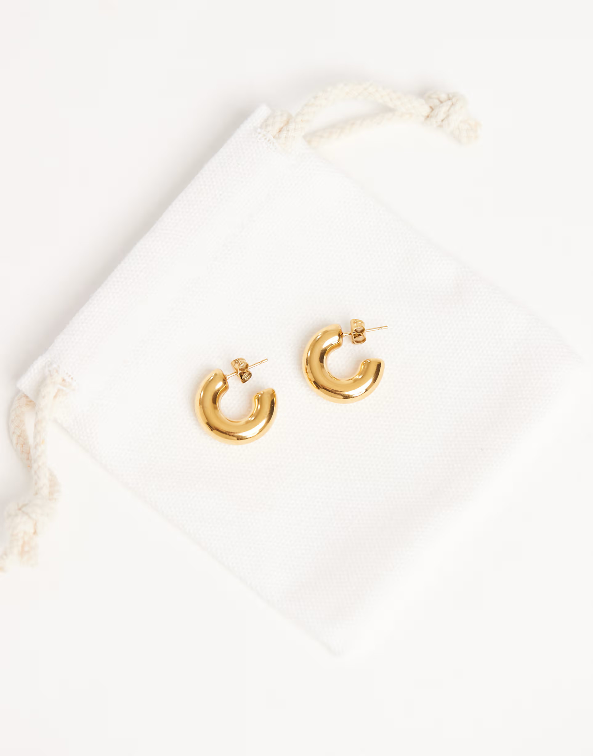 ASOS DESIGN waterproof stainless steel small chubby hoop earrings in gold tone with gift bag | AS... | ASOS (Global)