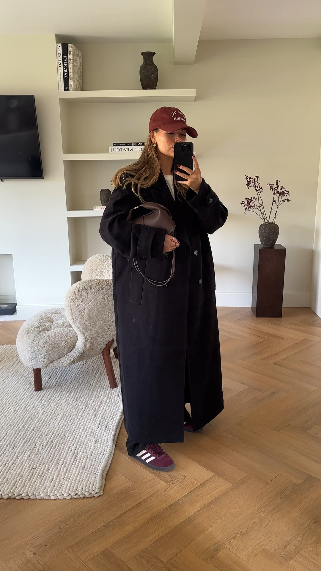 A very casual effortless look that still looks put together. This outfit is kinda giving Hailey bieber vibes. 

I am just loving burgundy red at the moment and love adding a slight pop of colour for autumn to this neutral outfit. 

The long single breasted coat is from H&M. It’s quite long on me compared to the model online but I actually like this oversized look. I am 5.5 height and I went for a size small. 

I styled the coat with a basic white T-shirt from Bash Paris, some burgundy gazelle trainers, anine bing baseball cap and Polene Paris bag. 

#LTKfindsunder50 #LTKstyletip #LTKfindsunder100