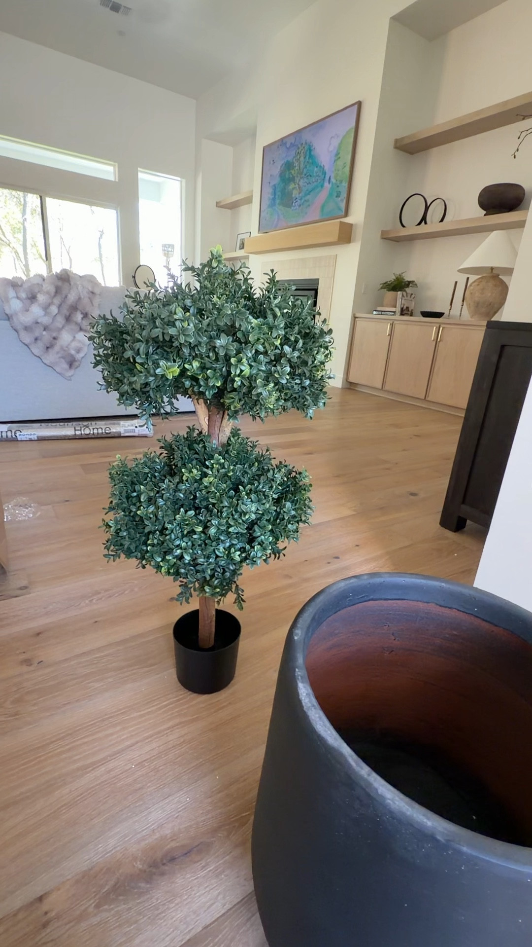 Outdoor faux shrub from Amazon comes in a two pack, and the quality is so realistic. Also great oversized planters from Amazon.