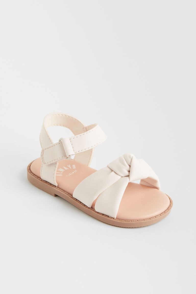 New ArrivalSandals in faux leather with two wide foot straps with decorative knot detail at front... | H&M (US + CA)