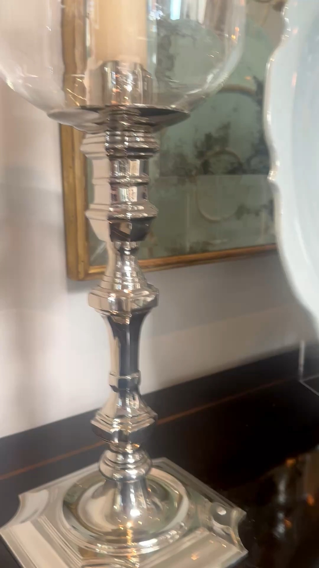 

One simple styling trick for instant evening ambiance.
A pillar candle placed inside a glass hurricane softens the glow and creates that warm, flickering light that instantly elevates a room.

Perfect for consoles, dining tables, or sideboards when the goal is a relaxed, candlelit mood. #LTKhome
#LTKstyle
#candlelight
#hurricanecandleholder
#homeambiance
#interiorstyling
#interiorinspo
#hostinginspo
#cozycorners
#elevatedhome
#homeeditorial


#LTKHome