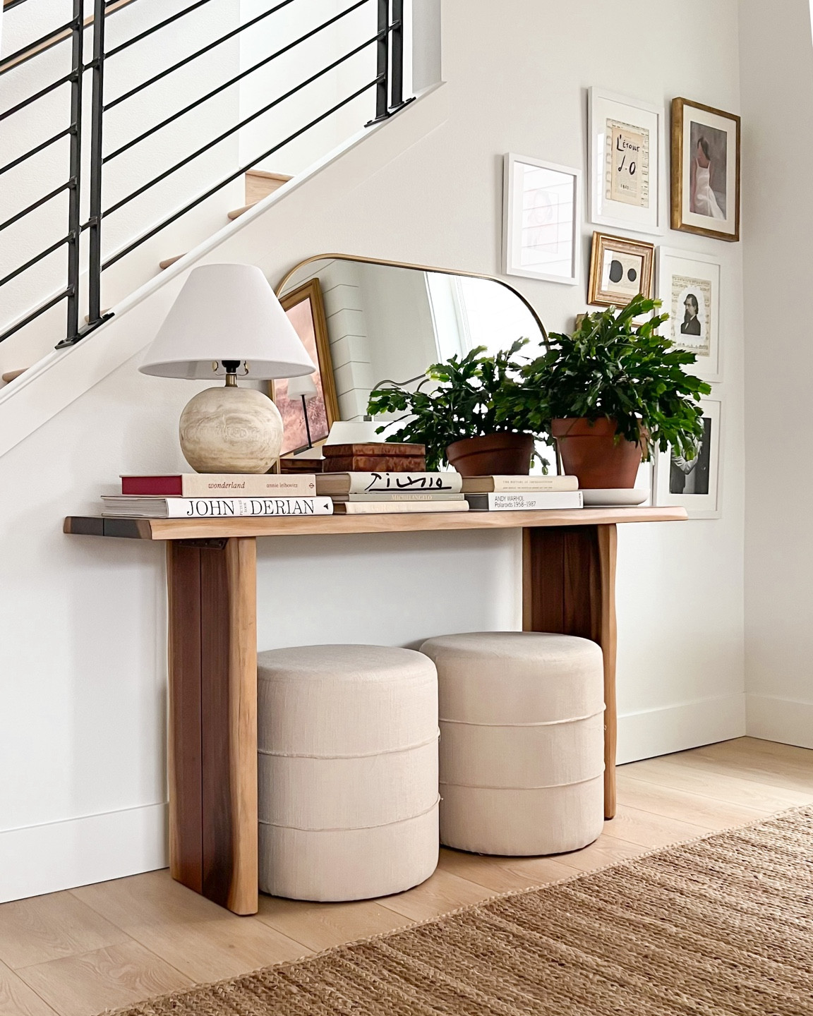 Console table styling, entry console, living room decor, world market sansur console table, wood raw edge table, round mudcloth ottomans, Target lamp, home decor, transitional home, neutral living room inspo, arch mirror, coffee table books, Homebyjulianne 

#LTKFind #LTKhome #LTKstyletip