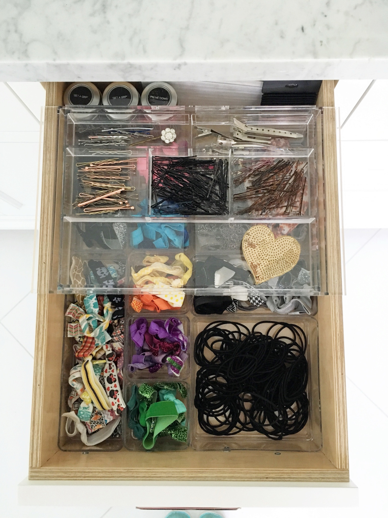 As I mentioned and promised, here is a photo of the same drawer that I organized in this bathroom, using the expandable divider that sits on top of the drawer frame. If you have limited storage or bathroom counter, space, this is a great addition to any drawer. This organizer works in most bathroom drawers, but you’ll definitely want to double check that your drawer has the clearance on the left and right side to open and close while this is sitting on the drawer frame.

#LTKMostLoved #LTKhome #LTKbeauty