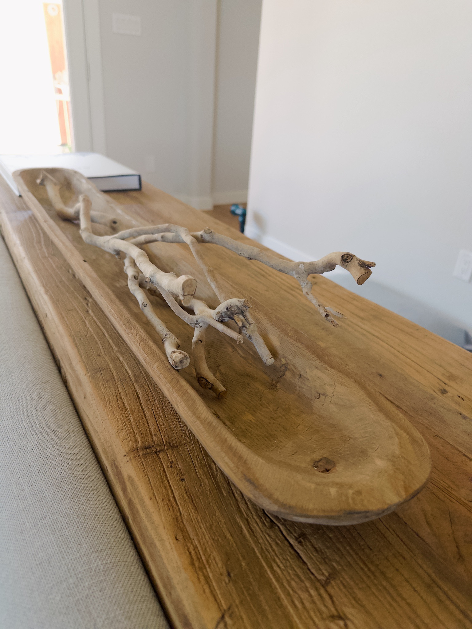 I needed a large piece for my consale table, I love a dough bowl. You can always change out what’s in it for something new. Currently I’m going with coastal vibes and added this long skinny driftwood piece.

#LTKSpringSale #LTKhome #LTKU