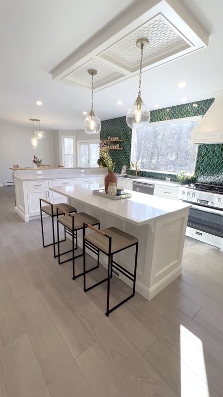 Kitchen renovation with a very bold, counter-to-ceiling, emerald green backsplash. This open and airy kitchen has tons of natural light.

#LTKhome #LTKVideo