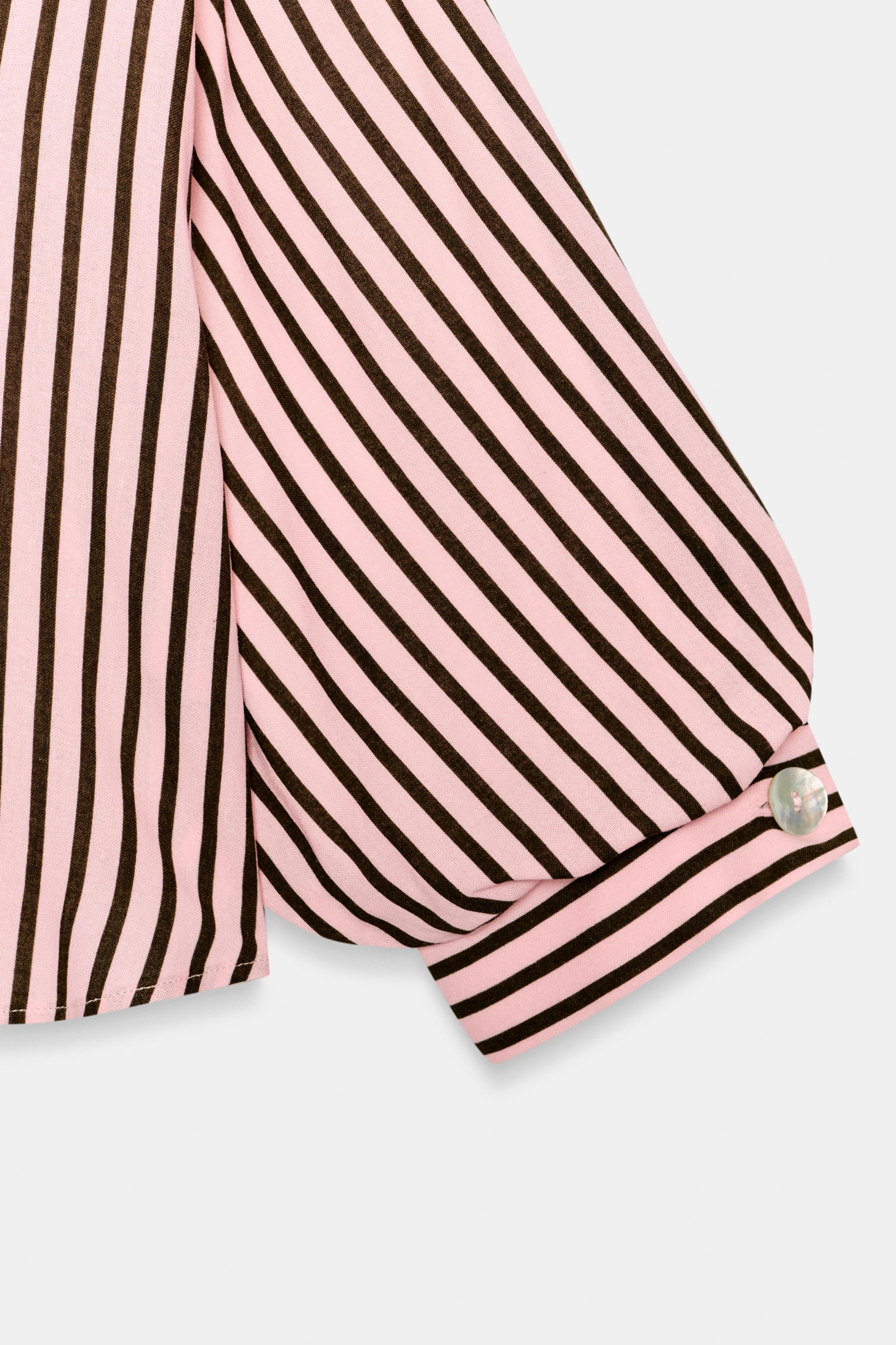 Lapel collar shirt with a V-neckline and below-the-elbow balloon sleeves. Front button closure. | Zara US