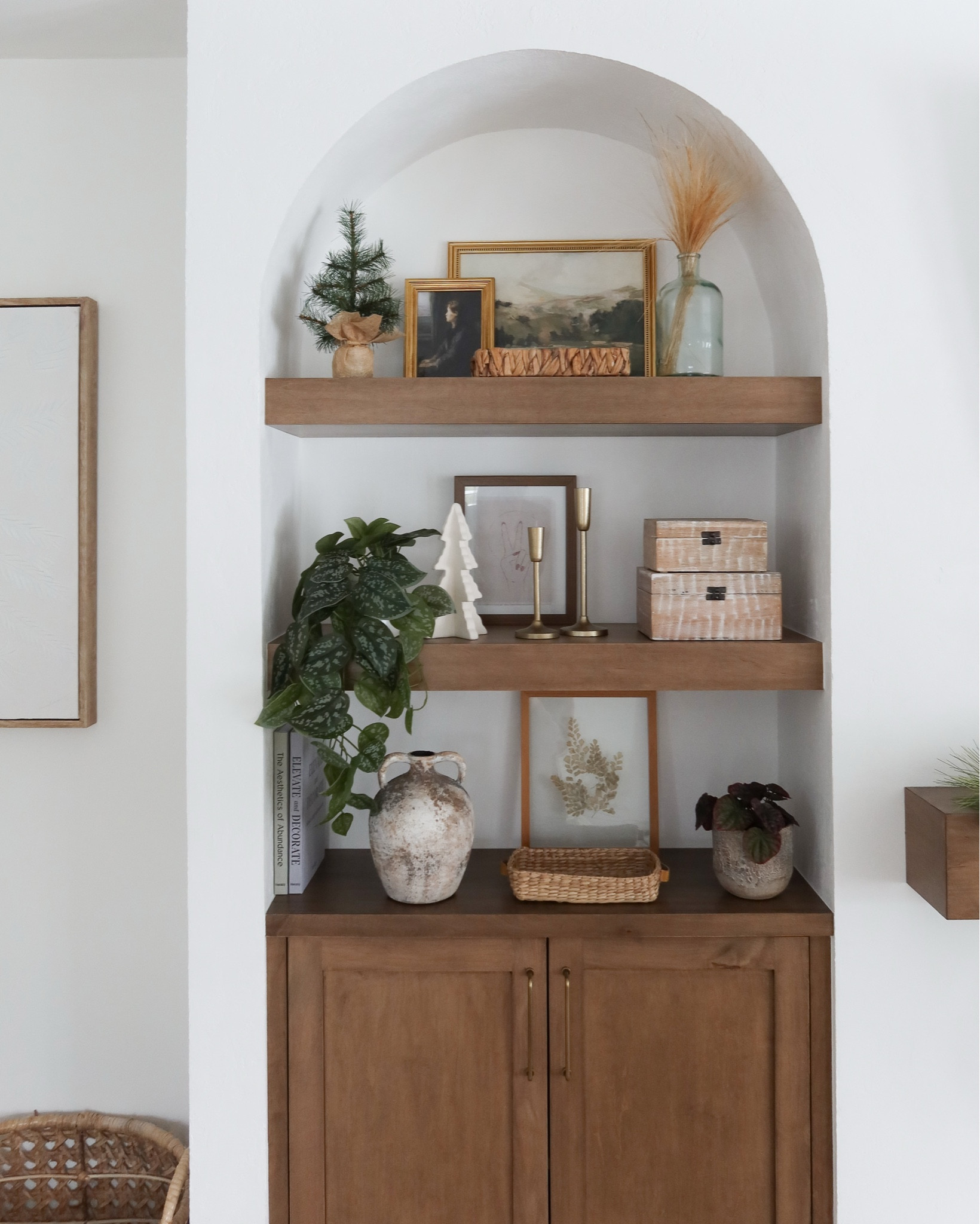Our earthy open shelves in our living room! One of my brings renovations in our home thus far!

#LTKHome #LTKFindsUnder100 #LTKootd