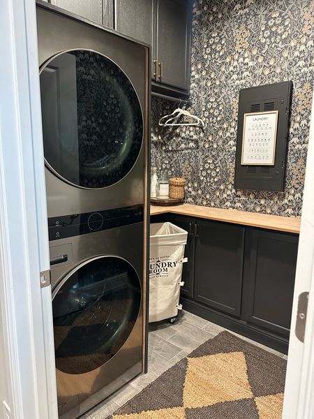 Laundry vibes with a tower washer and dryer, wallpaper, area rug, and laundry organising accessories 

#LTKHome #LTKStyleTip #LTKFindsUnder100