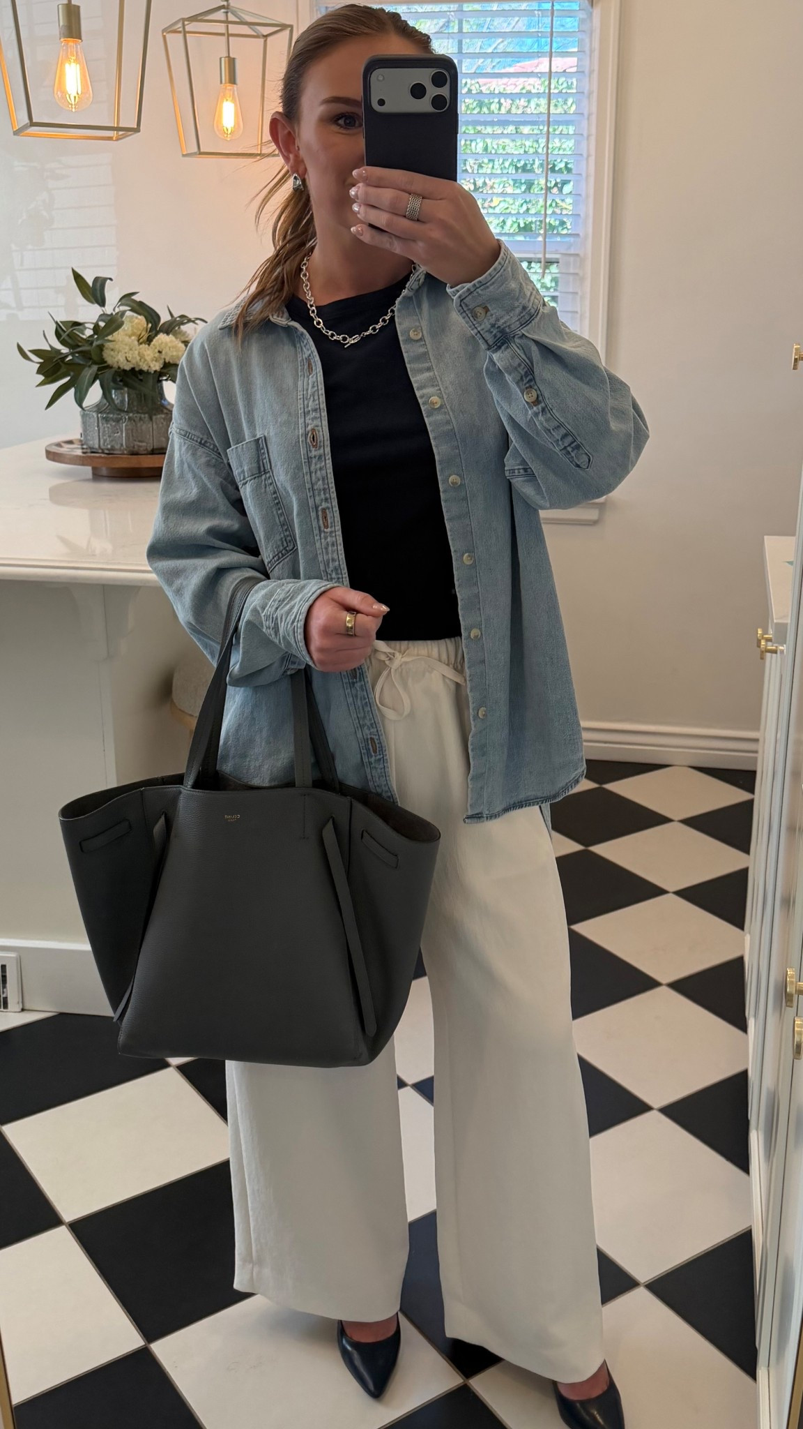 Work OOTD 🖤 easy, put together, and comfortable. Styled an oversized Aritzia denim button up with Aritzia wide leg trousers and a Reformation top, finished with Cole Haan heels, simple Amazon jewelry, and a Celine tote. Simple pieces that just work for everyday office outfits.

#workootd #workoutfit #officeoutfit #businesscasual #everydayworkwear #widelegpants #Aritiza #reformation #Celine #colehaan #neutraloutfit #minimalstyle #classicstyle #effortlessstyle #outfitinspo #everydaystyle #ltkstyle #ltkfinds #ltkwear #womeninbusiness #ootd

#LTKWorkwear #LTKootd #LTKPetite