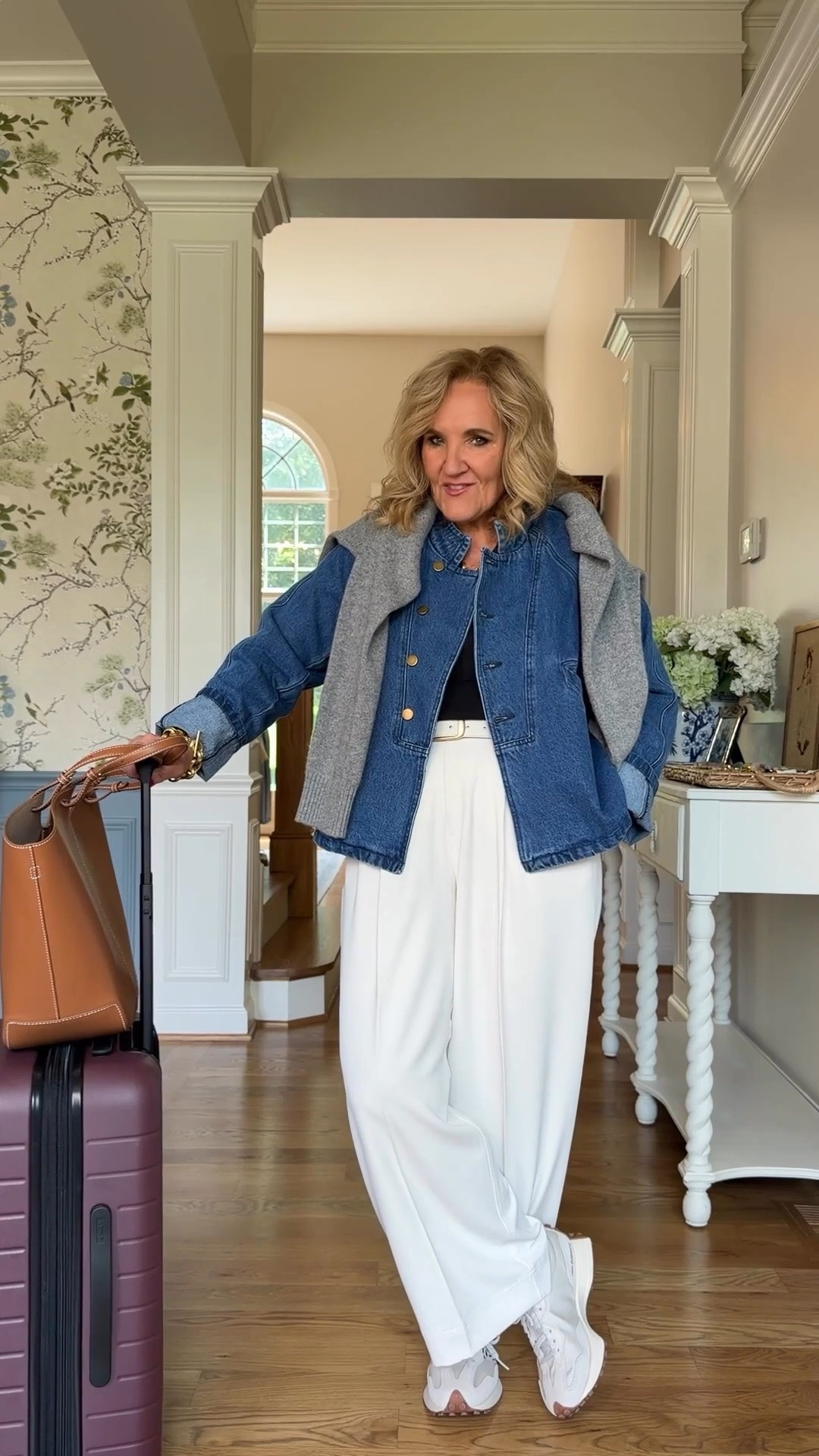 This is exactly how I like to travel, comfortable but still pulled together. I’m wearing a medium petite in the no-wrinkle trousers, and that denim jacket with the sweater tossed over my shoulders makes the whole thing feel like me.