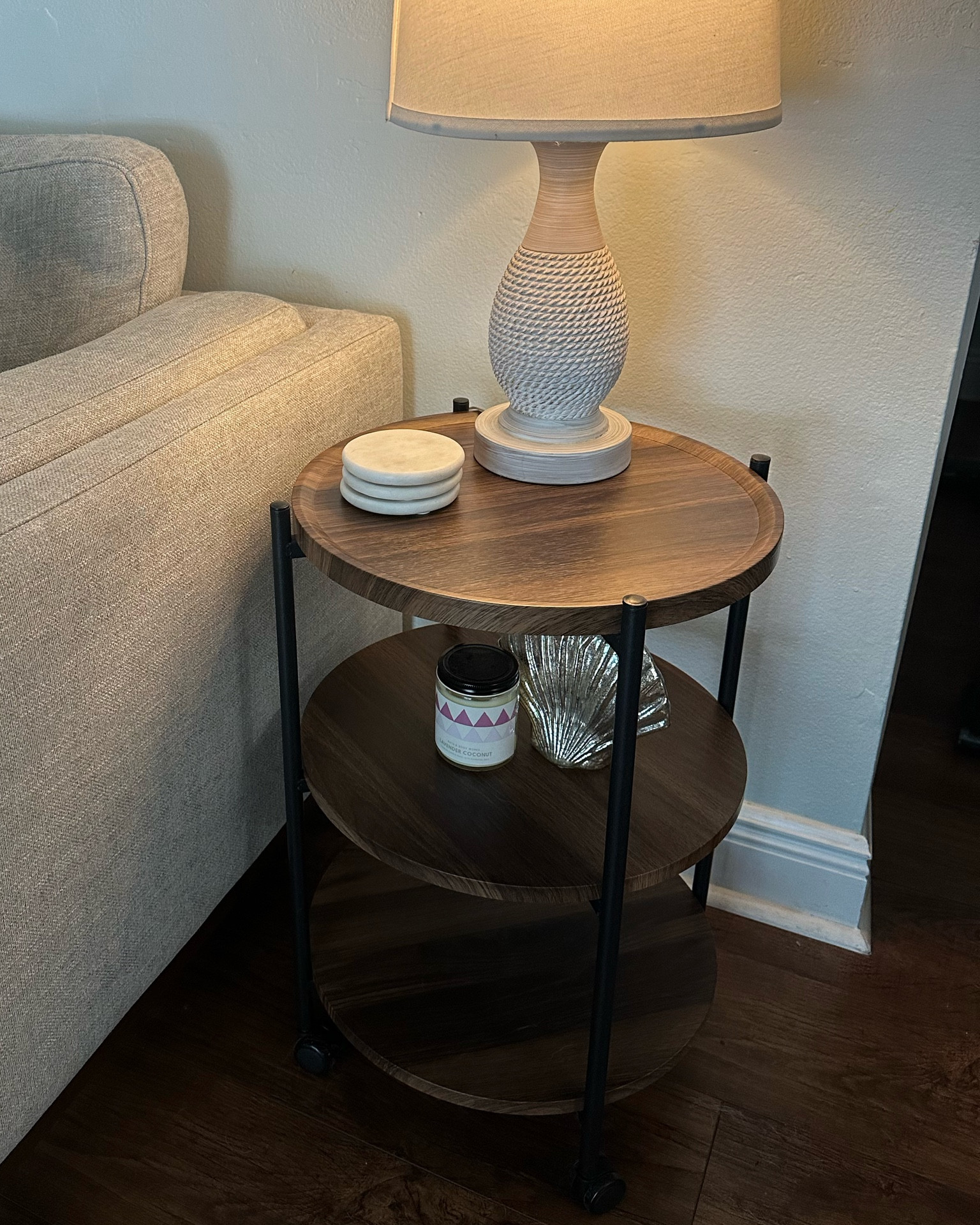 A perfect 3-tier round end table for any room in your home! It only took around 15 minutes to put together and I love that it has wheels (that can also lock in place). It matches our laminate flooring great and looks high end! 

#LTKHome #LTKSaleAlert