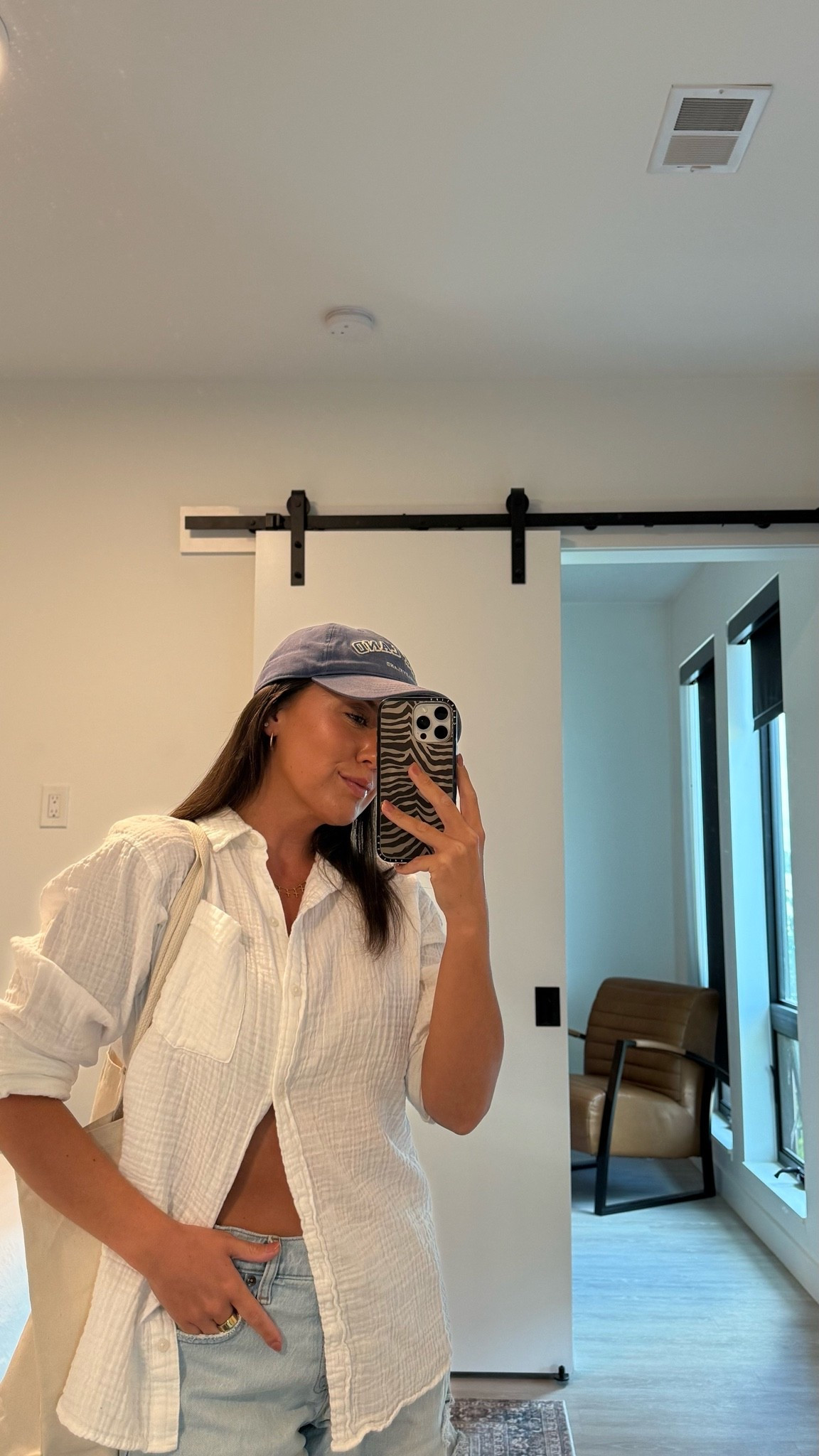 Love this lightweight white button up as a swim coverup! Size M