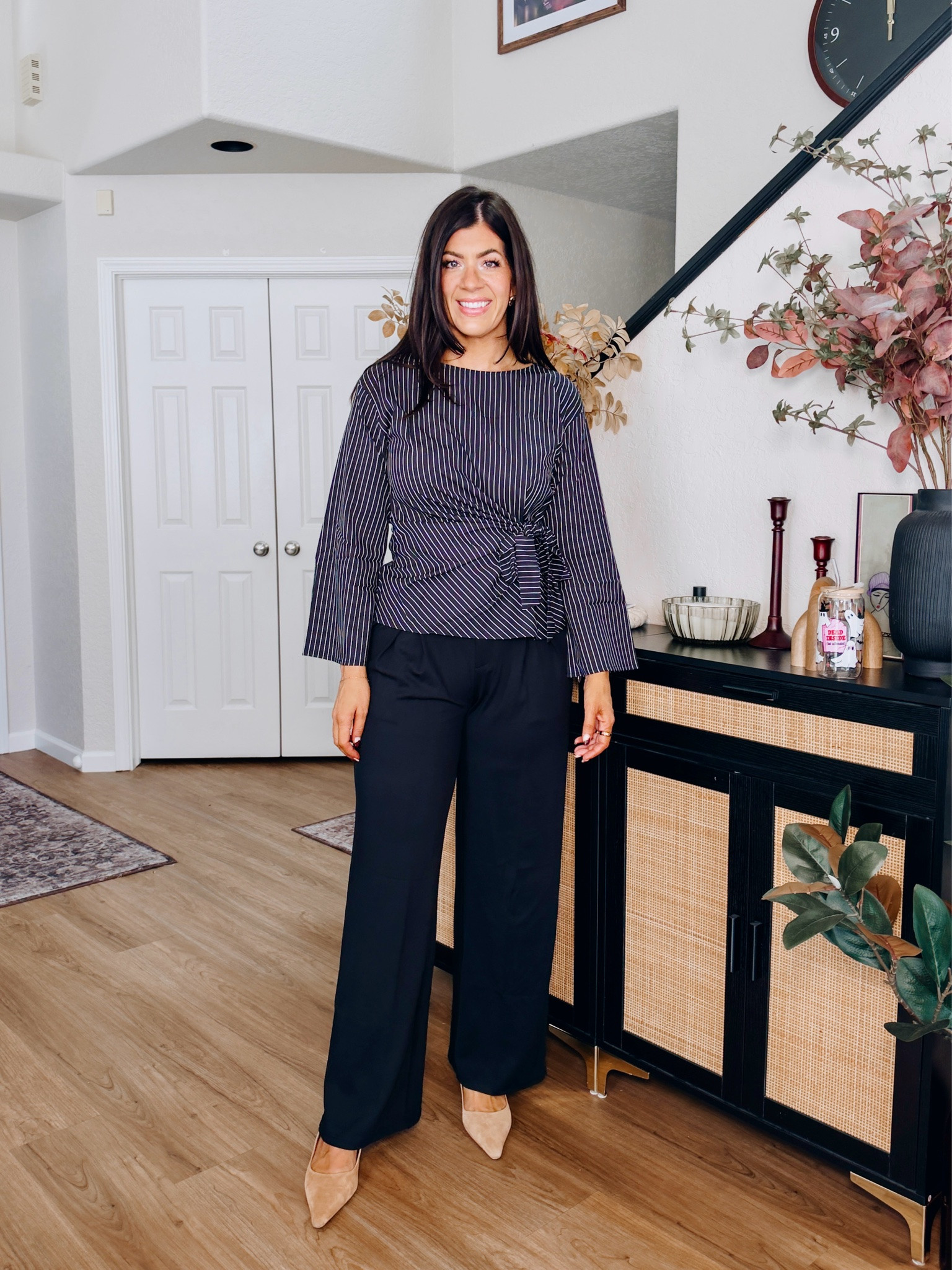 Workwear under $50
In a medium wrap top and large long trouser!