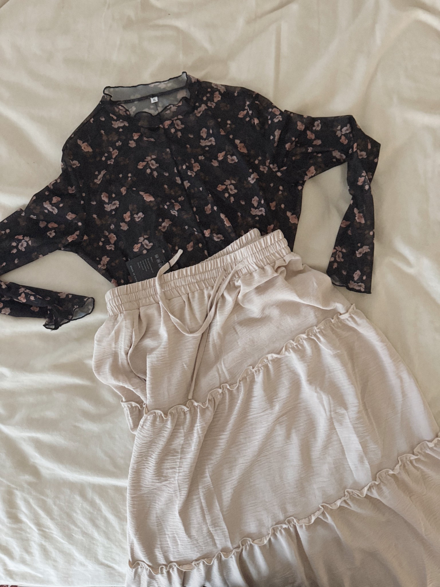 This cute flowy skirt paired with this see through top, Both from Amazon 

#LTKMidsize #LTKFindsUnder50 #LTKStyleTip