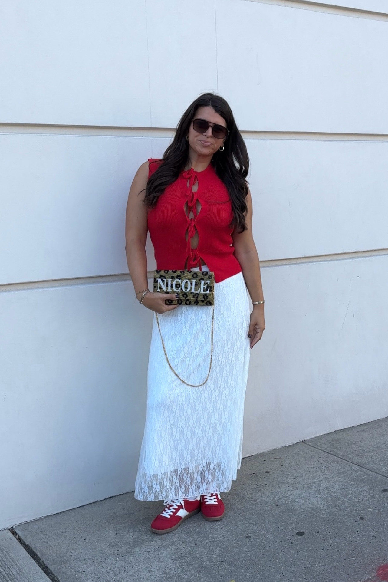 Loving the cheetah & red combo for fall! 

bag is custom island to eastside - code NICOLELINDER should get you 15% your order / custom bags! 

White lace skirt, red tie top, red sneakers, pops of red, red and cheetah, fall outfit ideas, beaded bag

#LTKFindsUnder50 #LTKFindsUnder100 #LTKStyleTip