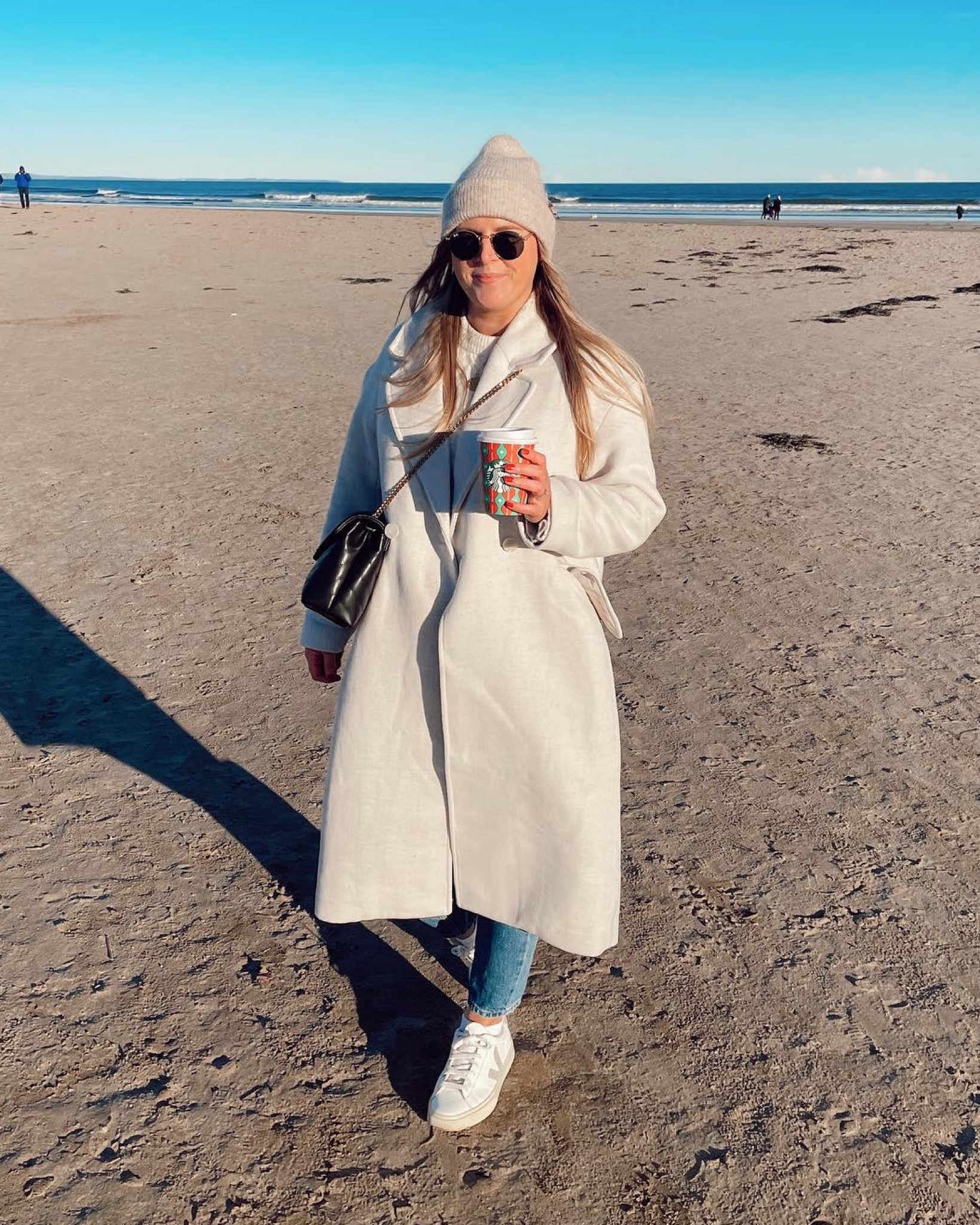 Neutral minimal cosy winter outfit with oversized cream h&m coat and beige beanie! Winter chic outfit with rayban round sunglasses and Veja trainers 

#LTKunder50 #LTKSeasonal #LTKeurope