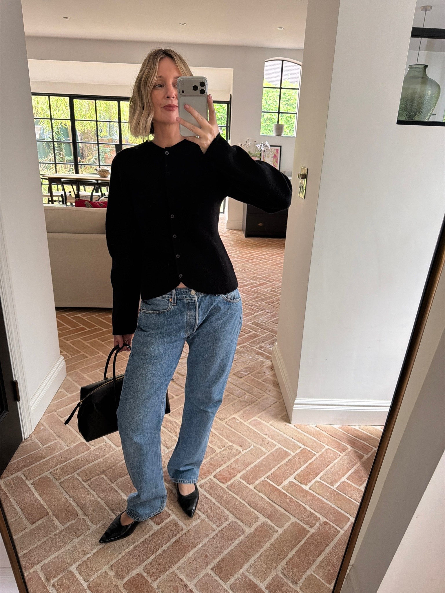 black fringe hem cardigan, black fringe trim knit top, cropped tassel jumper, evening knitwear, statement fringe detail, straight leg jeans, light wash denim, mid rise jeans, black pointed kitten heels, black slingback pumps, black going out shoes, elevated denim outfit, dressed up jeans, date night look, evening basics, quiet luxury, elevated basics, effortless chic, transitional dressing, ltkstyletip, ltkseasonal, ltkfindsunder100, outfit inspo, capsule wardrobe essentials

#LTKeurope #LTKdatenight #LTKworkwear