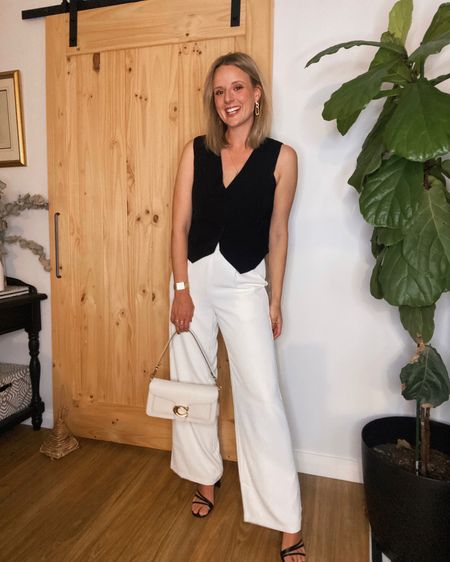 White pants outfit

Black waistcoat and white wide leg pants to head out to dinner.

#LTKaustralia #LTKSeasonal #LTKitbag