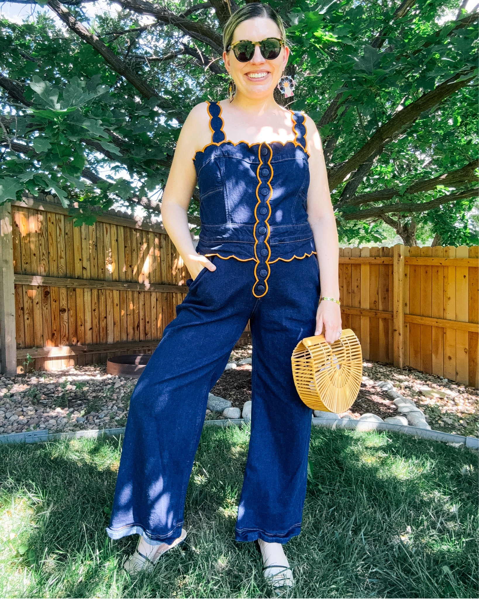 Look 11 - Main Street Muse
A curated style series

When you think of Farm Rio, you probably picture bold prints and tropical color - but they’ve been doing some of the most creative denim I’ve seen lately, and I’m here for it. This jumpsuit is proof: denim covered buttons, scalloped details, and that signature playful spirit, all wrapped up in high-quality denim that feels amazing to wear.

IMO this is a fantastic transitional piece -  silhouette keeps it summery, but the weight of the denim makes it perfect for easing into fall. It’s an unexpected classic with a fun twist - basically, everything I love about Farm Rio.

Jumpsuit - Farm Rio (linked)
Earrings - Le Chic Miami (linked)
Bag - Cult Gaia (linked)
Sunglasses - Tom Ford (linked)
Ring & Bracelet - Rocksbox
Shoes - Steve Madden (similar linked)

✨ Want to try it yourself?
This exact jumpsuit is available to rent right now! Use my link here: https://share.nuuly.com/kat42828

🌻 About this capsule:
Each of my capsule collections is a themed two-week journey into a specific mood or season. Main Street Muse is about savoring the final days of summer while embracing the first signs of fall. It’s colorful, romantic, a little kitschy, and inspired by small-town Americana—all about finding beauty in the in-between.

#MainStreetMuse #CapsuleCollection #FarmRio #FarmRioStyle #FarmRioDenim #DenimJumpsuit #TransitionalStyle #FallStyleInspo #SummerToFall #PlayfulFashion #ColorfulStyle #EclecticStyle #ScallopDetail #FashionStorytelling #LTKstyle #LTKfashion