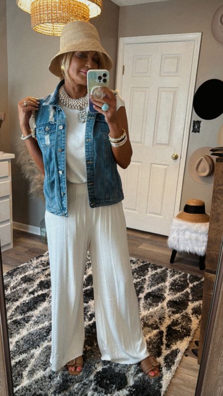 A denim vest is a must this season.  I love this one because it has some gentle distressing & I feel it will go with everything.  It tts but I sized up to a lg for a more oversized fit.   I’m wearing a med in my cream set 

#LTKstyletip