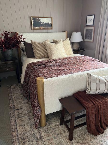 Moody bedroom ideas 

Taupe bedroom, burgundy kantha quilt, patterned throw pillows 