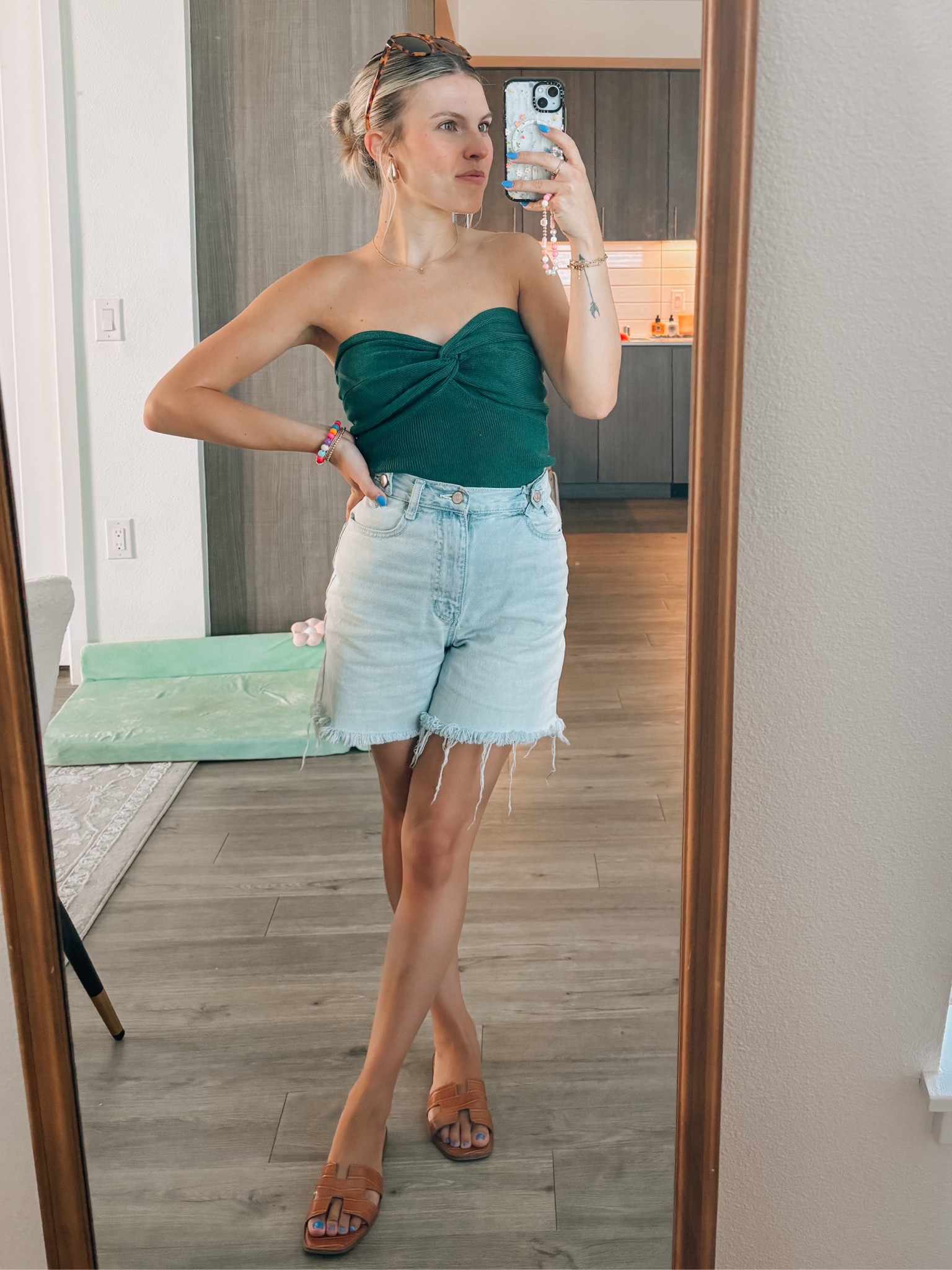 Summer outfit with green tube top and jean shorts 

#LTKSeasonal #LTKstyletip #LTKeurope