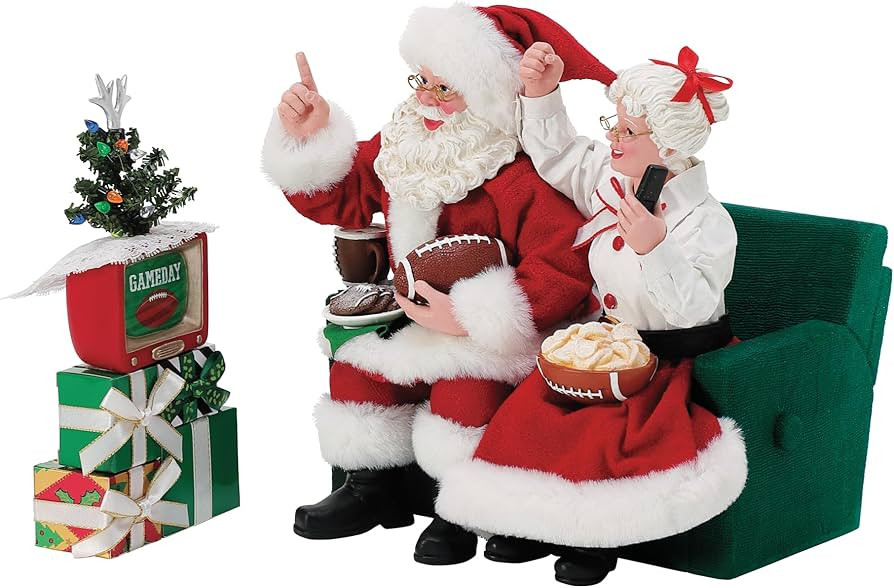 Department 56 Possible Dreams Sports and Leisure Santa and Mrs. Claus Binge Watching Football Fig... | Amazon (US)