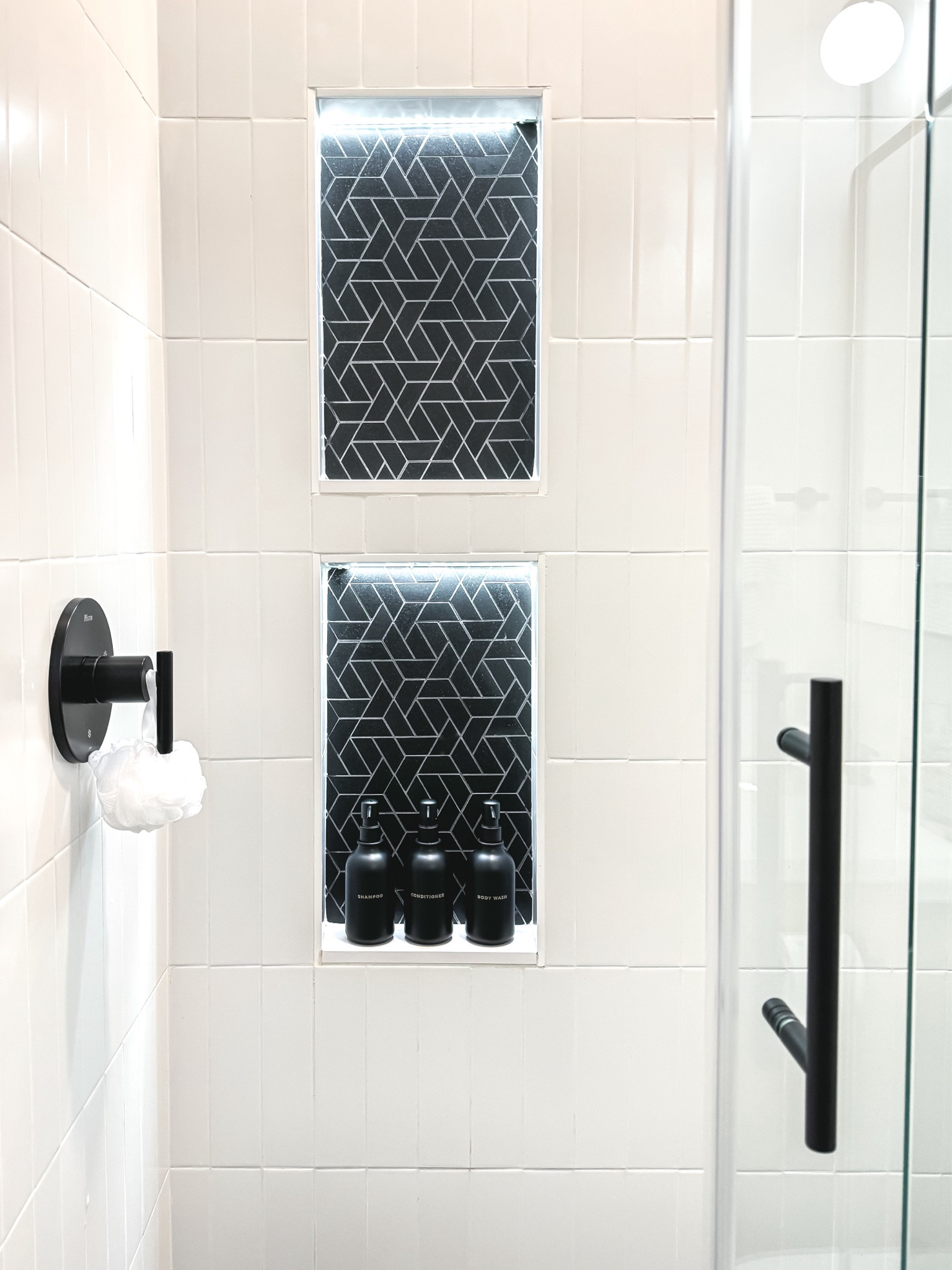 Matte black shampoo & conditioner dispenser bottle set at Amazon 