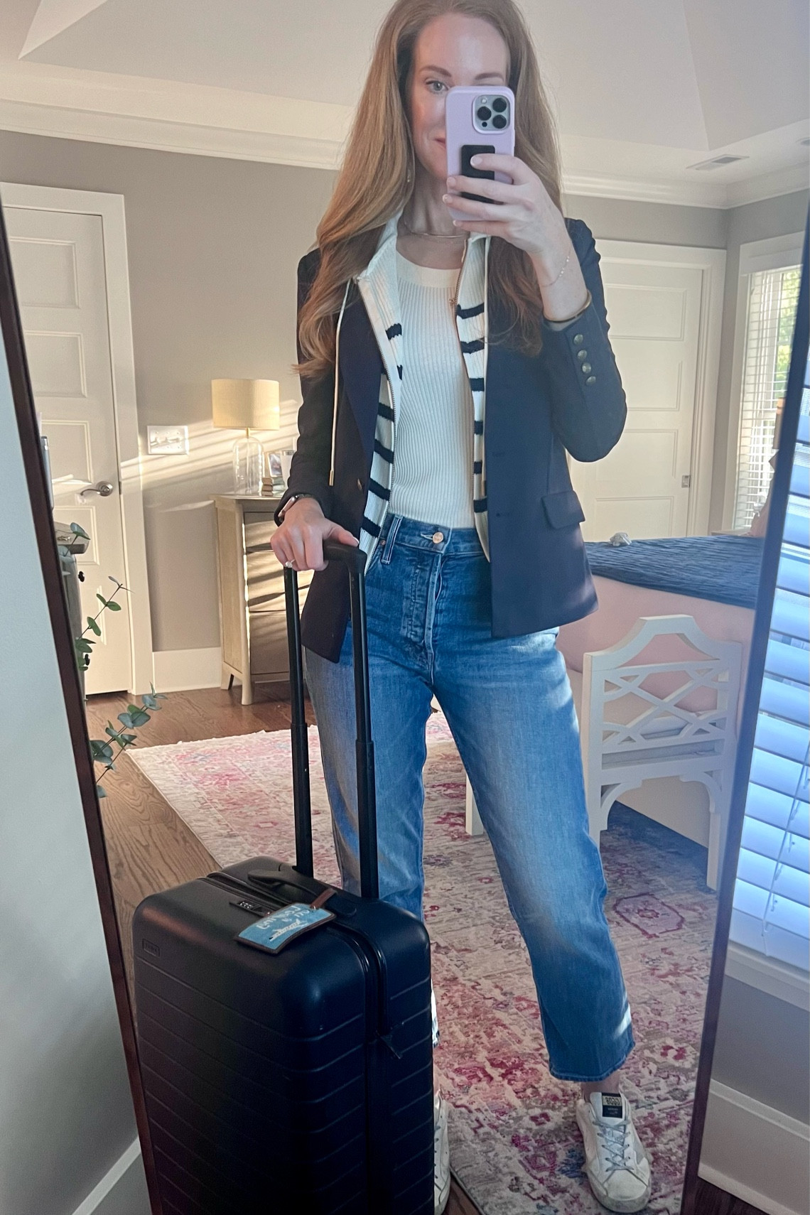 Travel outfit! 
This blazer from Evereve is two pieces in one. The sweater part can zip out so it’s just a navy blazer! 
And the Mother Tomcat jeans are super comfortable for a long travel day! 
No quick trip is complete without my Away carryon ✈️

#LTKstyletip #LTKtravel #LTKover40