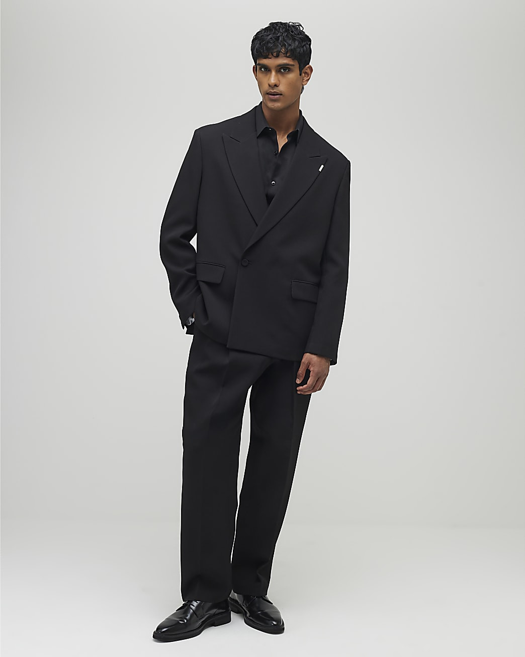 Black Relaxed Fit Pleated Suit Trousers | River Island UK & IE
