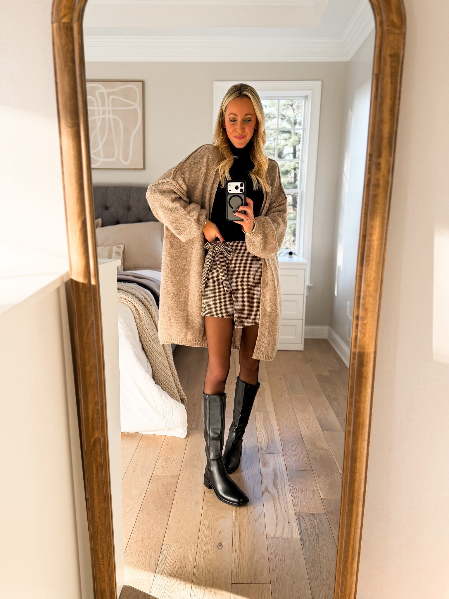 Thanksgiving outfit idea!  Love this plaid wrap skort! And this lightweight turtleneck long sleeve and this oversized long length cardigan have been go-to layers for me lately! Love these black knee high boots, too! 

#LTKHoliday #LTKFindsUnder50 #LTKWorkwear