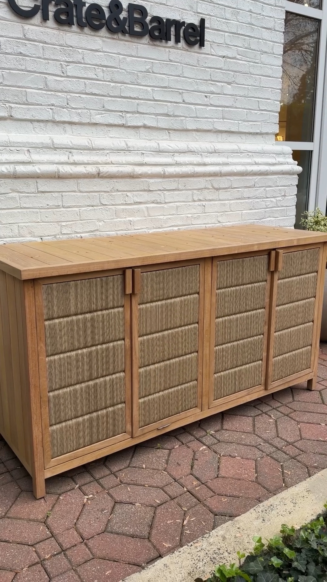Outdoor storage, but make it stylish! 😍 The Bali 62” Indoor/Outdoor Storage Credenza from Crate & Barrel brings the look of beautiful living room furniture to your patio or deck. 🤎 Crafted from solid teak and all-weather wicker, it’s designed to handle the outdoors while still looking elevated. ✨ The woven doors open to spacious compartments with shelving, perfect for storing outdoor essentials while keeping everything tucked away. 🙌🏻 A gorgeous and functional piece from the Bali outdoor collection—and it’s currently on sale. Linked this one plus more patio storage options! 🌿 #CrateAndBarrel #OutdoorFurniture #OutdoorStorage 

#LTKHome #LTKSaleAlert #LTKSeasonal